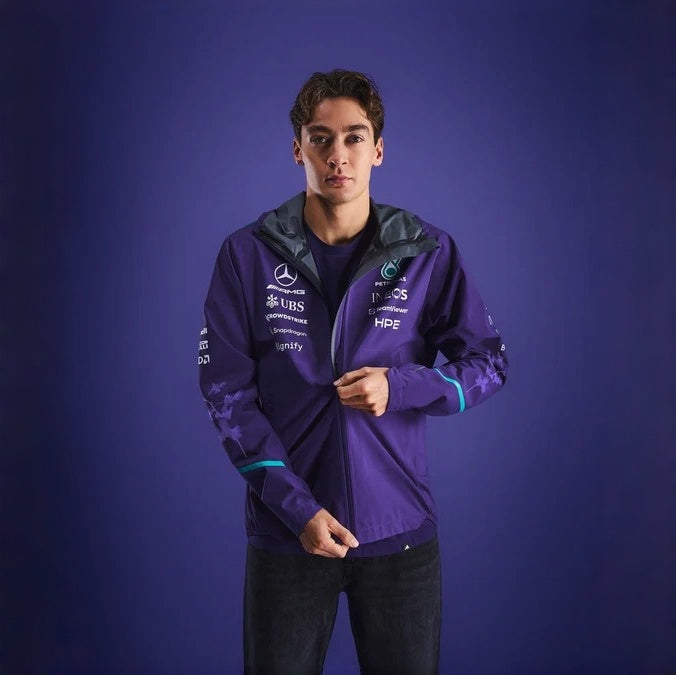 Mercedes-AMG Petronas Formula 1 Team Vanda Bloom Rain Jacket HZ9485 model wearing a stylish jacket against a dark background.