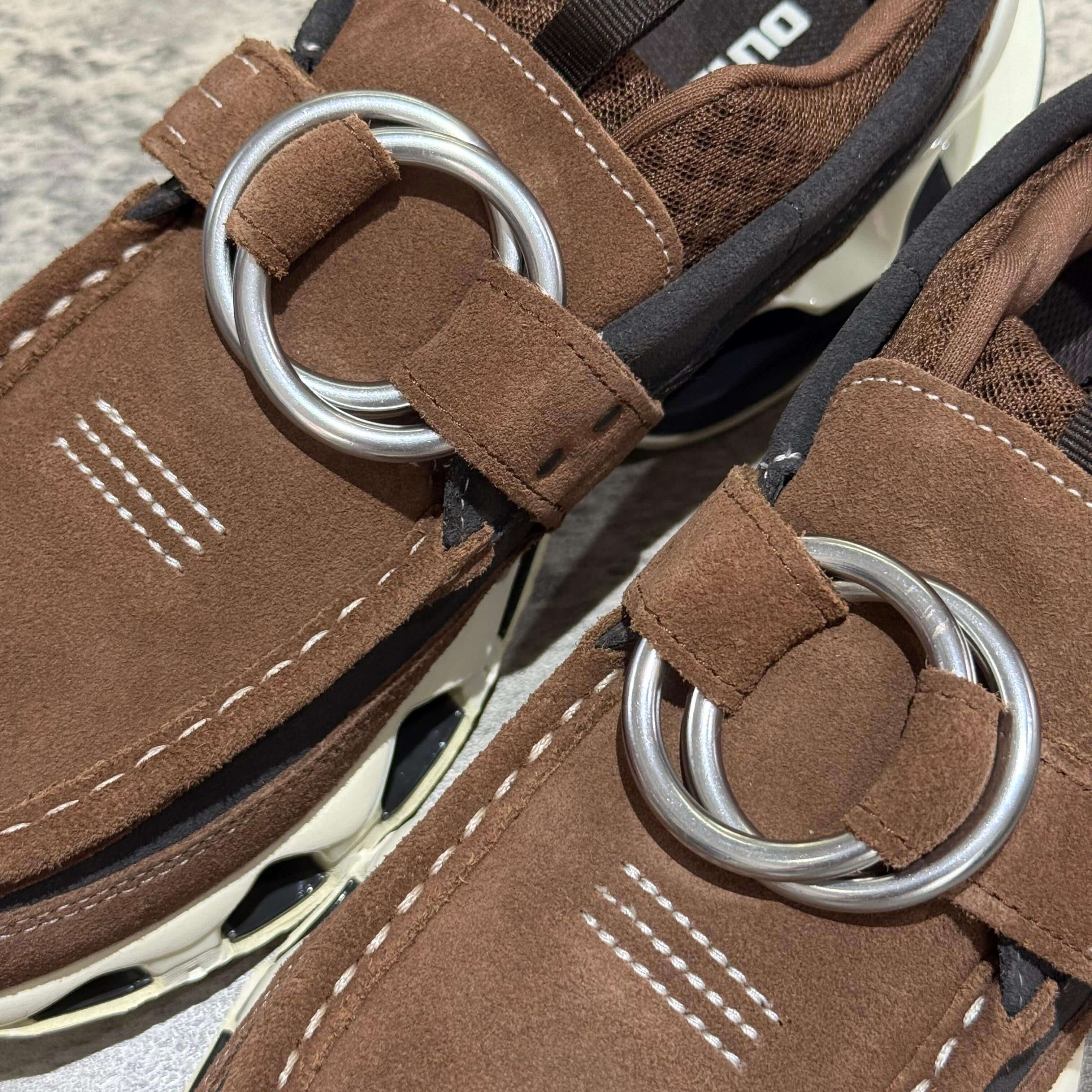 Close-up of Mizuno x Setsumasa Kobayashi Wave Prophecy Ring Moc - Brown showing details of the suede and ring buckle.