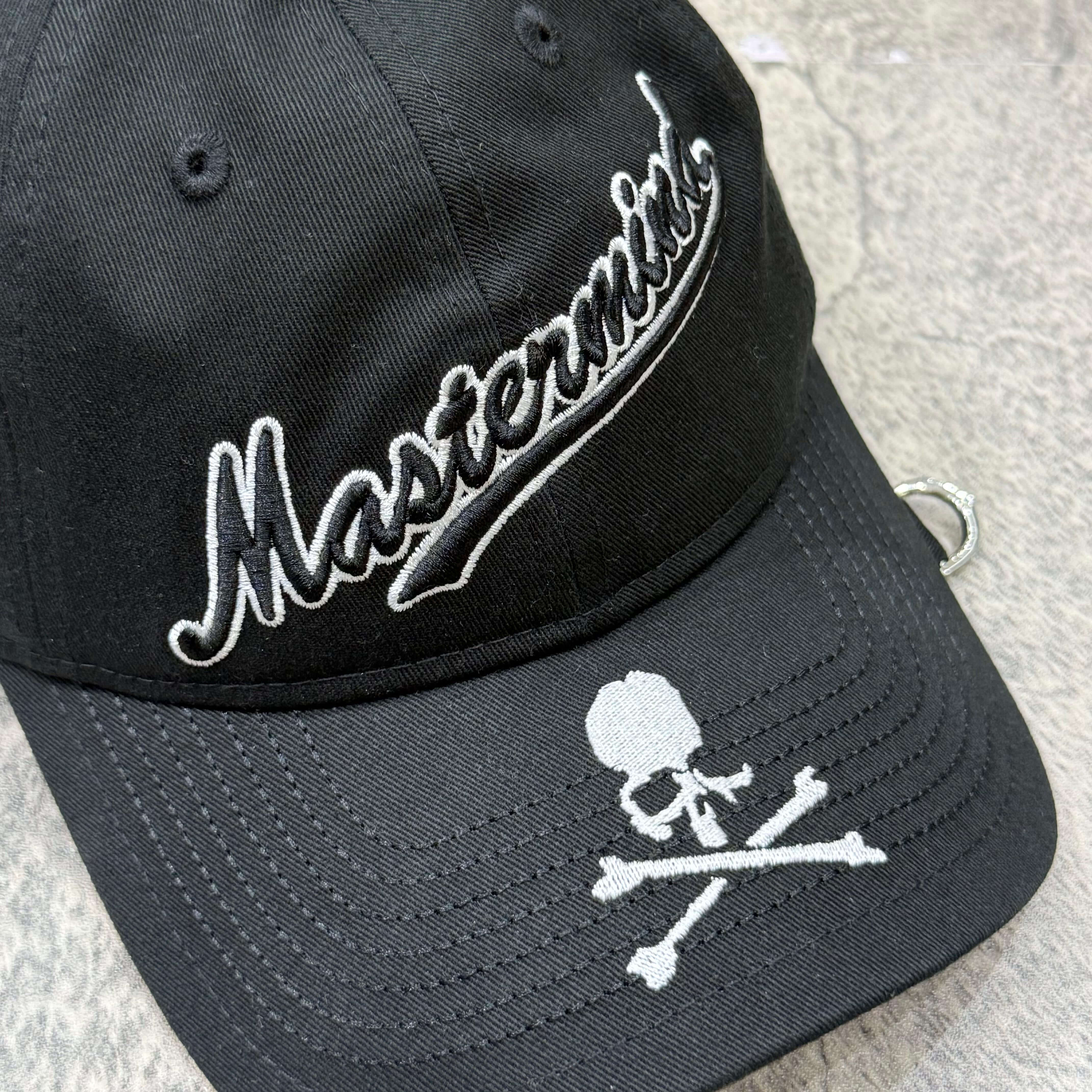 New Era x Mastermind black cap featuring embroidered logo and skull and crossbones design.