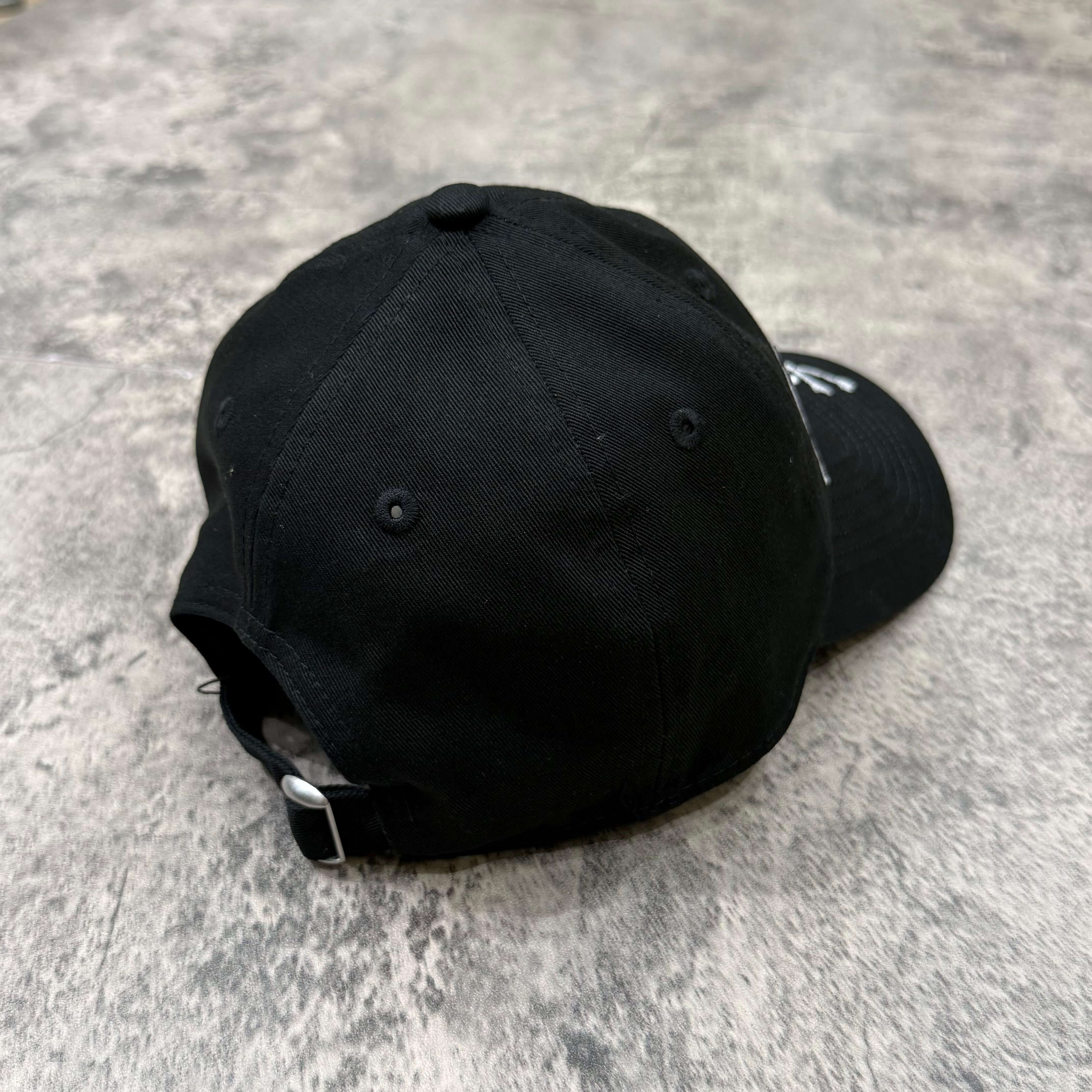 Back view of New Era x Mastermind Japan 9TWENTY Cap showcasing its black fabric and adjustable strap.