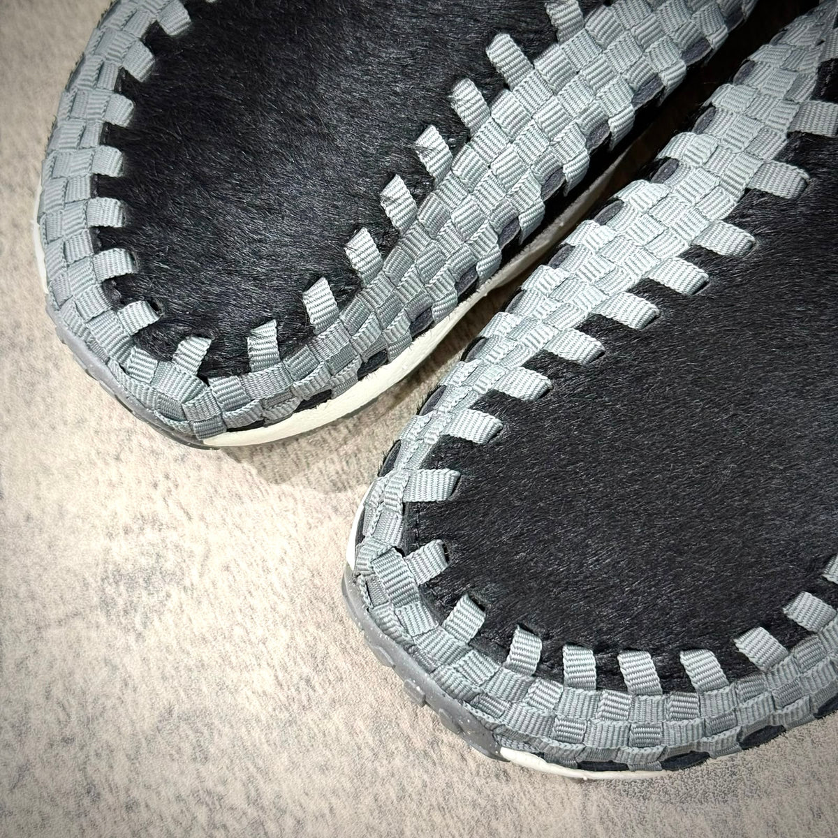 Nike Air Footscape Woven Black Smoke Grey FB1959-001 close-up of woven design and texture on the shoes.