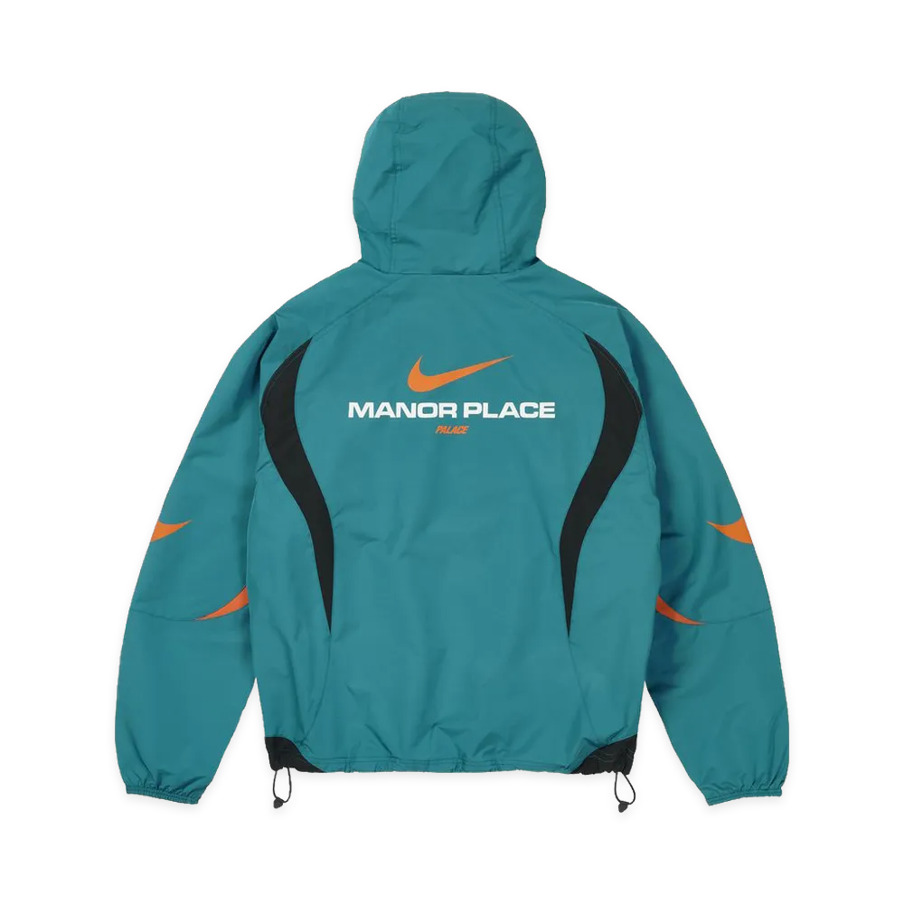 Back view of the Palace x Nike Manor Place Jacket featuring a hood and bold branding.