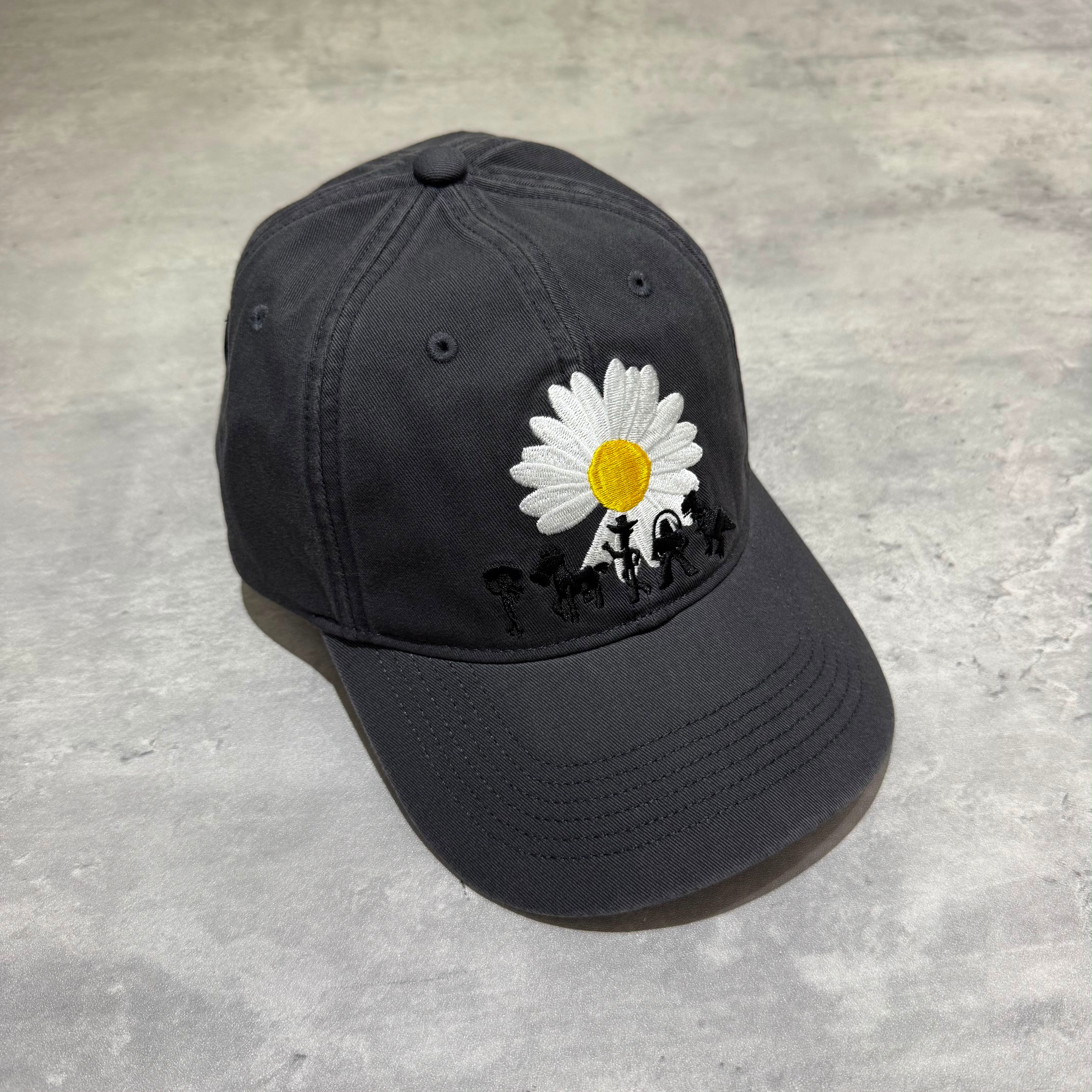 PEACEMINUSONE x Toy Story The First Fan - Cap 01 featuring a black cap with a floral design.