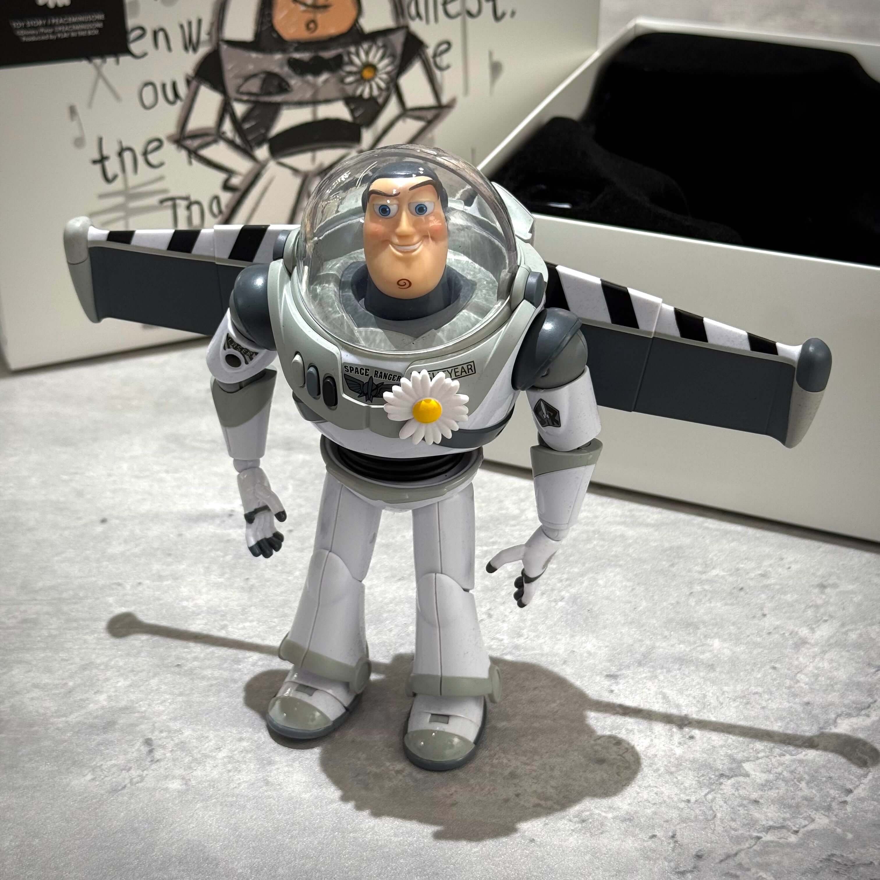 PEACEMINUSONE x Toy Story The First Fan - Action Figure Buzz standing with clean design and detailed features.