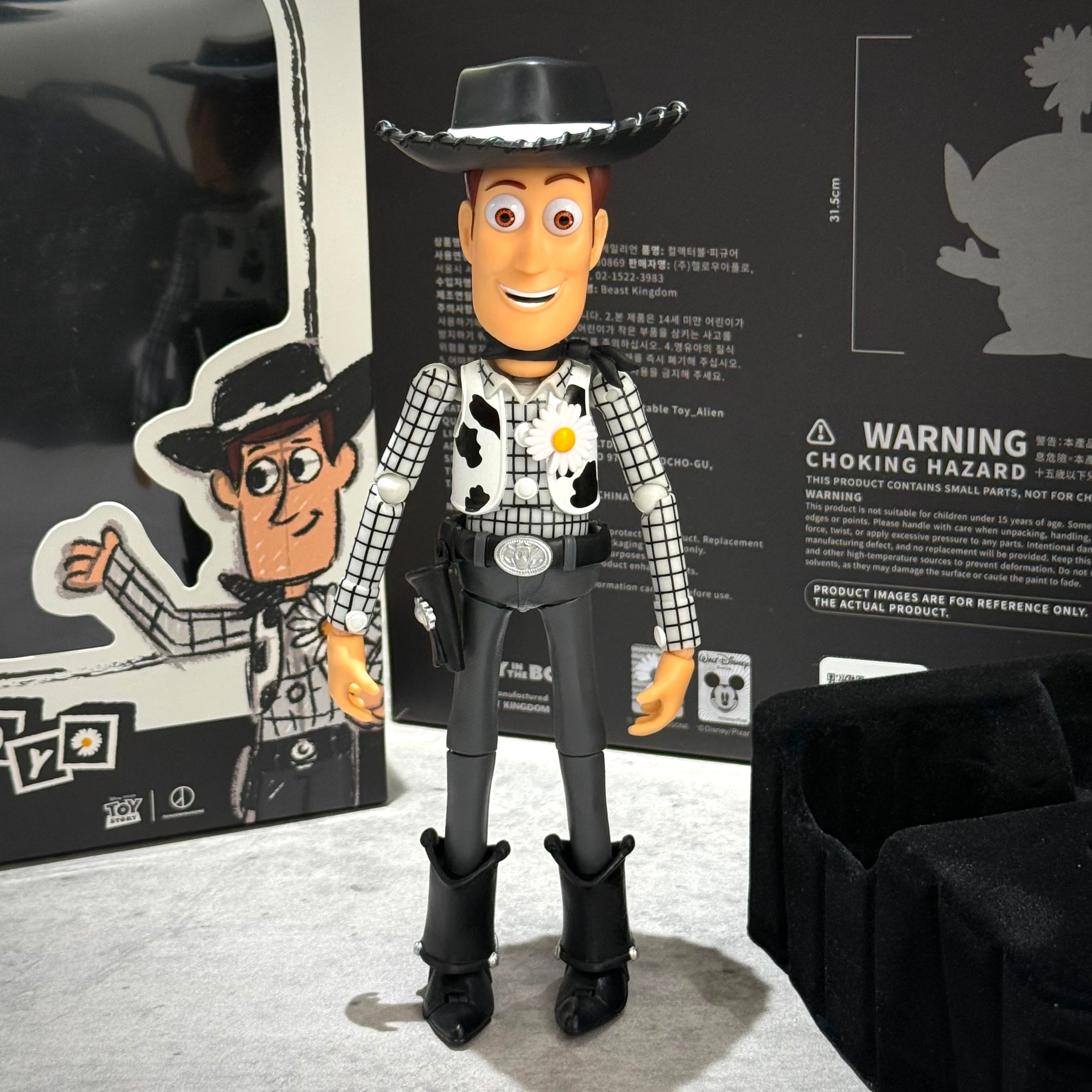 PEACEMINUSONE x Toy Story The First Fan - Action Figure Woody in black hat and cowboy outfit.