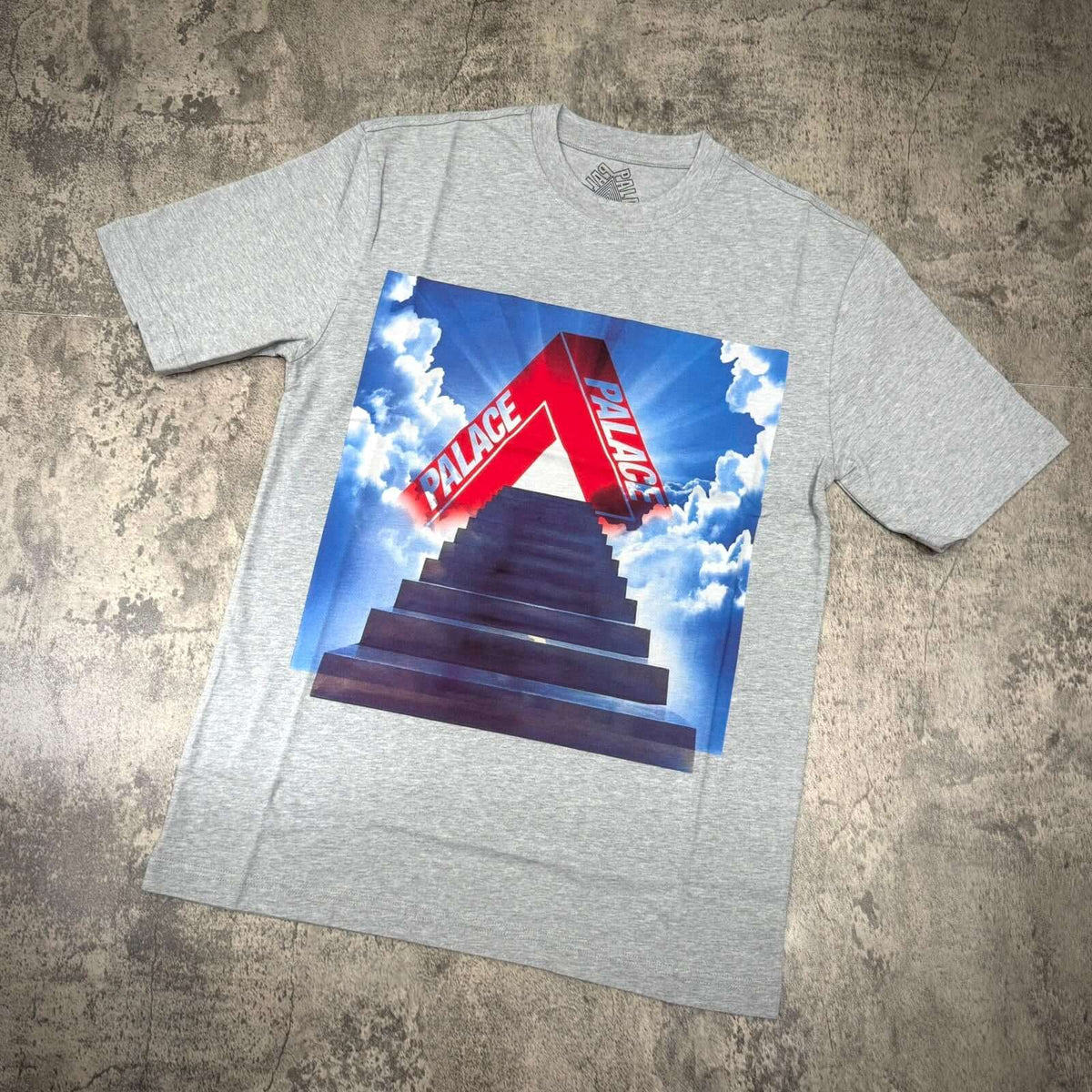 Palace Tri-Ternity Tee - Grey with bold graphic design featuring the Palace logo and a staircase leading to clouds.