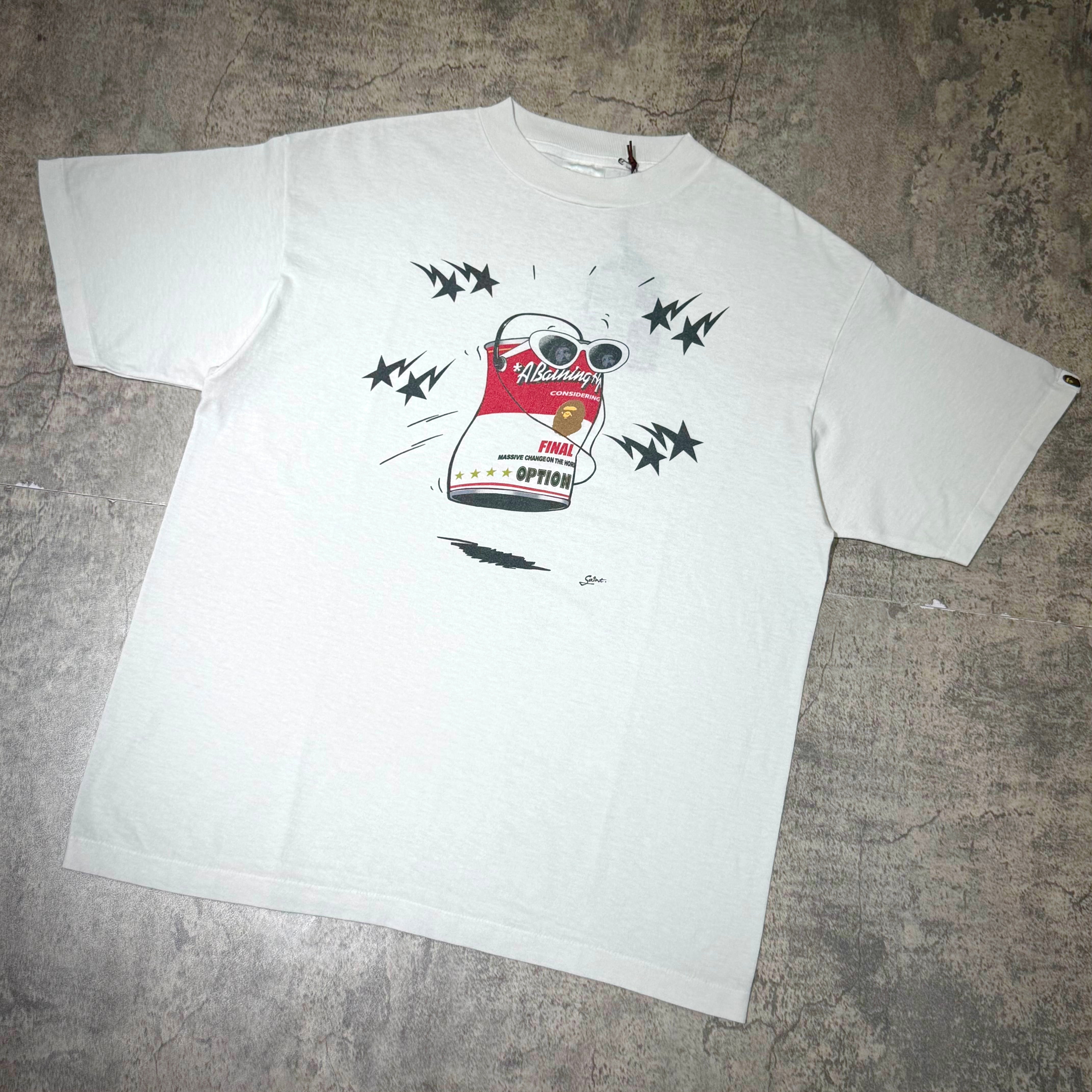 Saint Mxxxxxx BAPE Jump Tee featuring a graphic design on a white shirt, showcasing distinct and playful artwork.