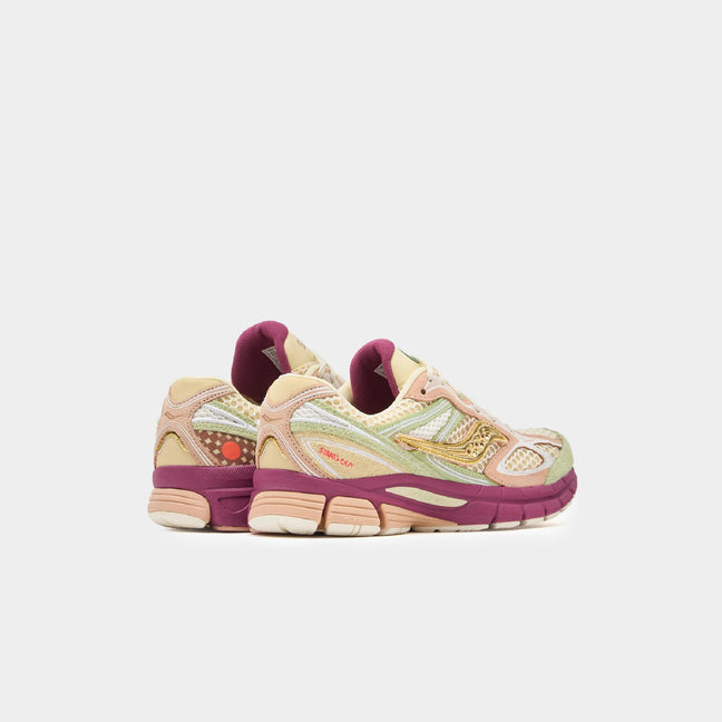 Saucony x Stan Birch ProGrid Guide 7 sneakers with pastel colors and purple accents.