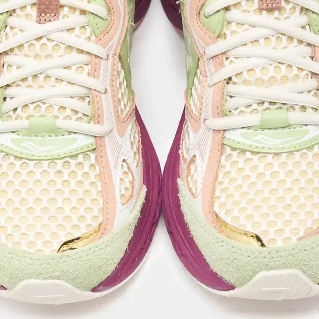 Close-up of Saucony x Stan Birch ProGrid Guide 7 running shoes showcasing colorful mesh design and detailed texture.