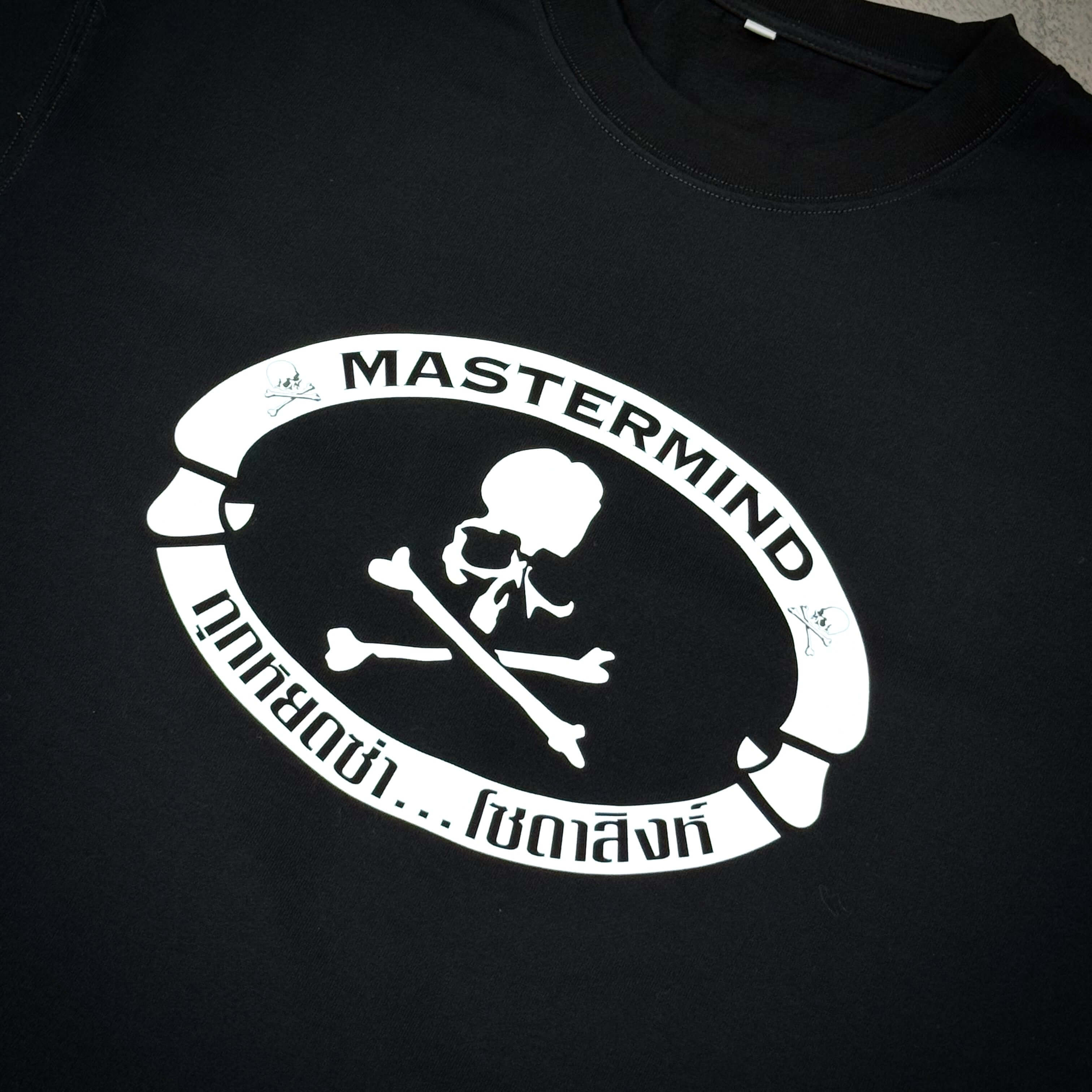 Singha Soda x Mastermind World SS Tee #1 featuring a bold black design with a skull and crossbones logo.