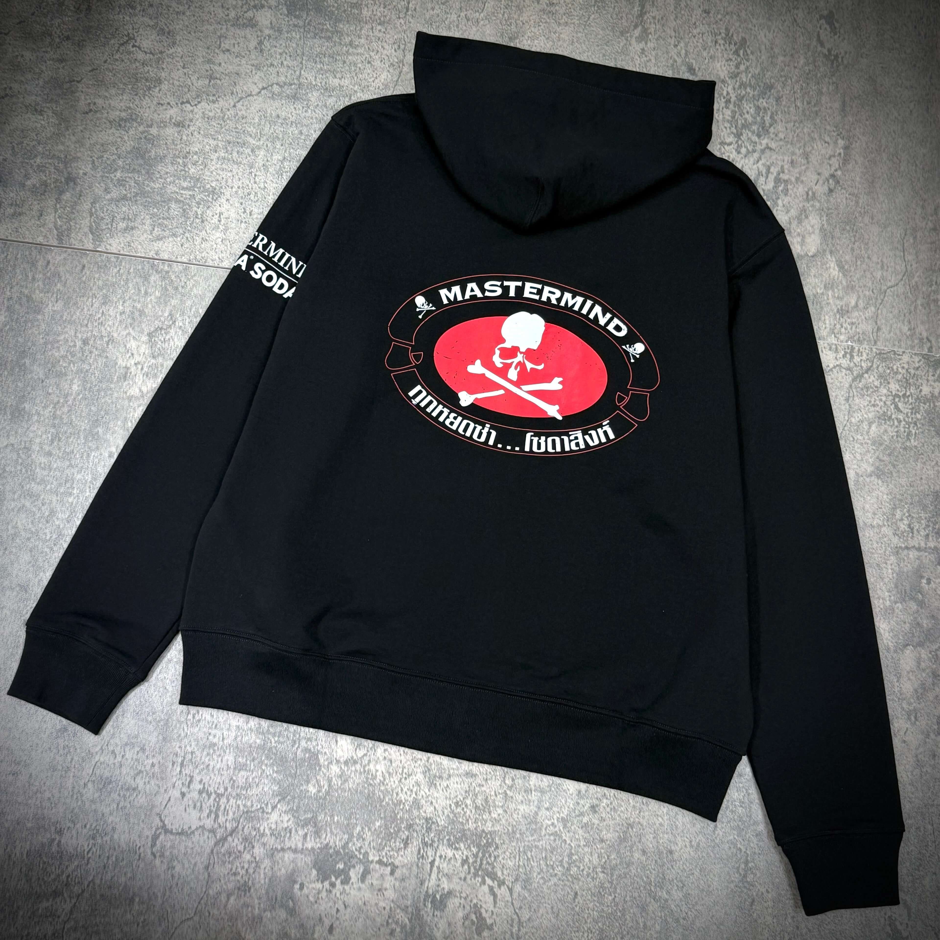 Singha Soda x Mastermind World Zip Up Hoodie featuring bold graphic design and black fabric, ideal for casual style.