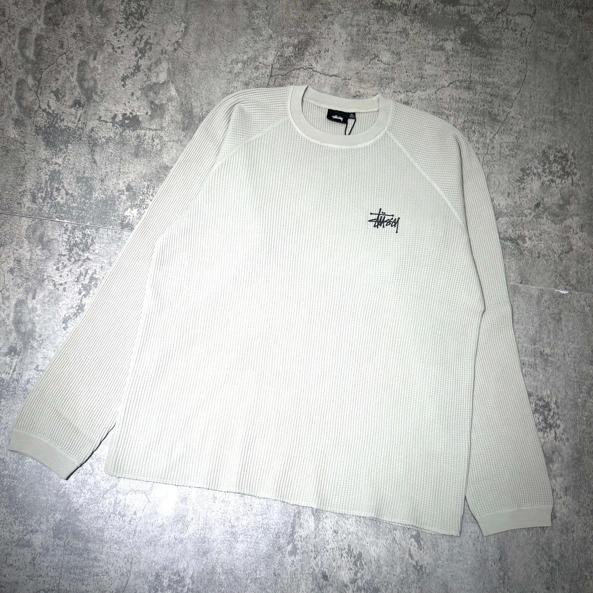 Stussy Basic Raglan Thermal LS Crew FW26 in light green, featuring a ribbed texture and the Stussy logo.