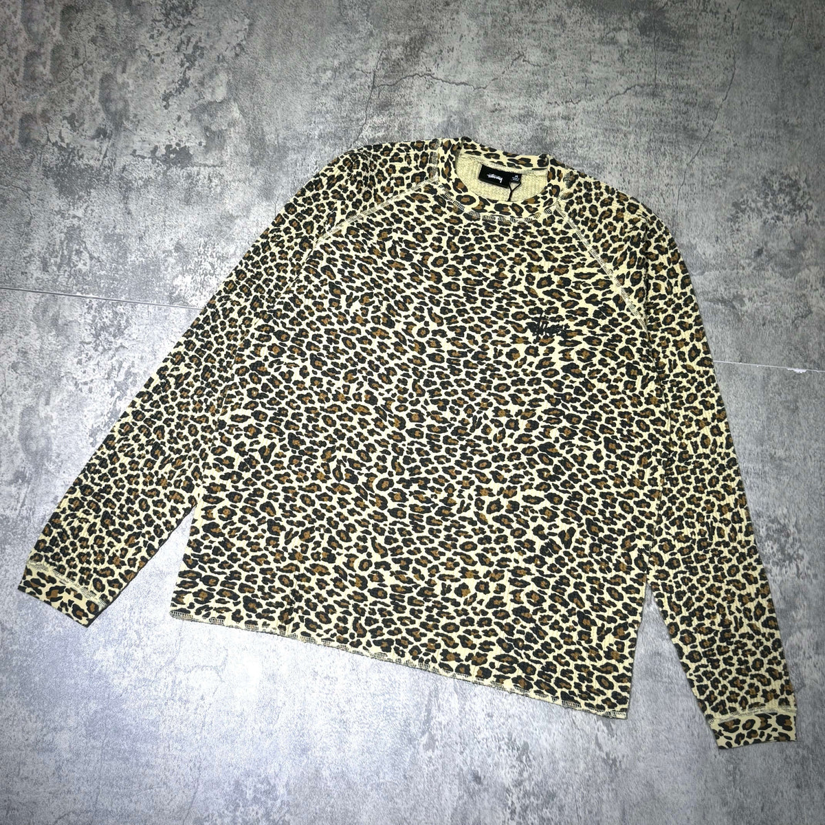 Stussy Basic Raglan Thermal LS Crew FW26 featuring a leopard print design on a long sleeve crew neck.