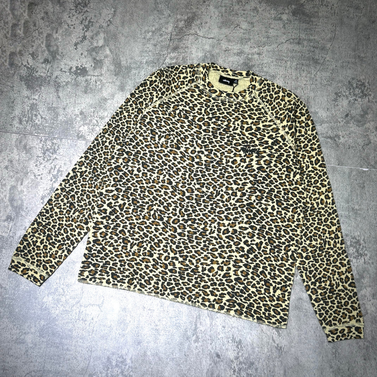Stussy Basic Raglan Thermal LS Crew FW26 featuring a leopard print design on a long sleeve crew neck.