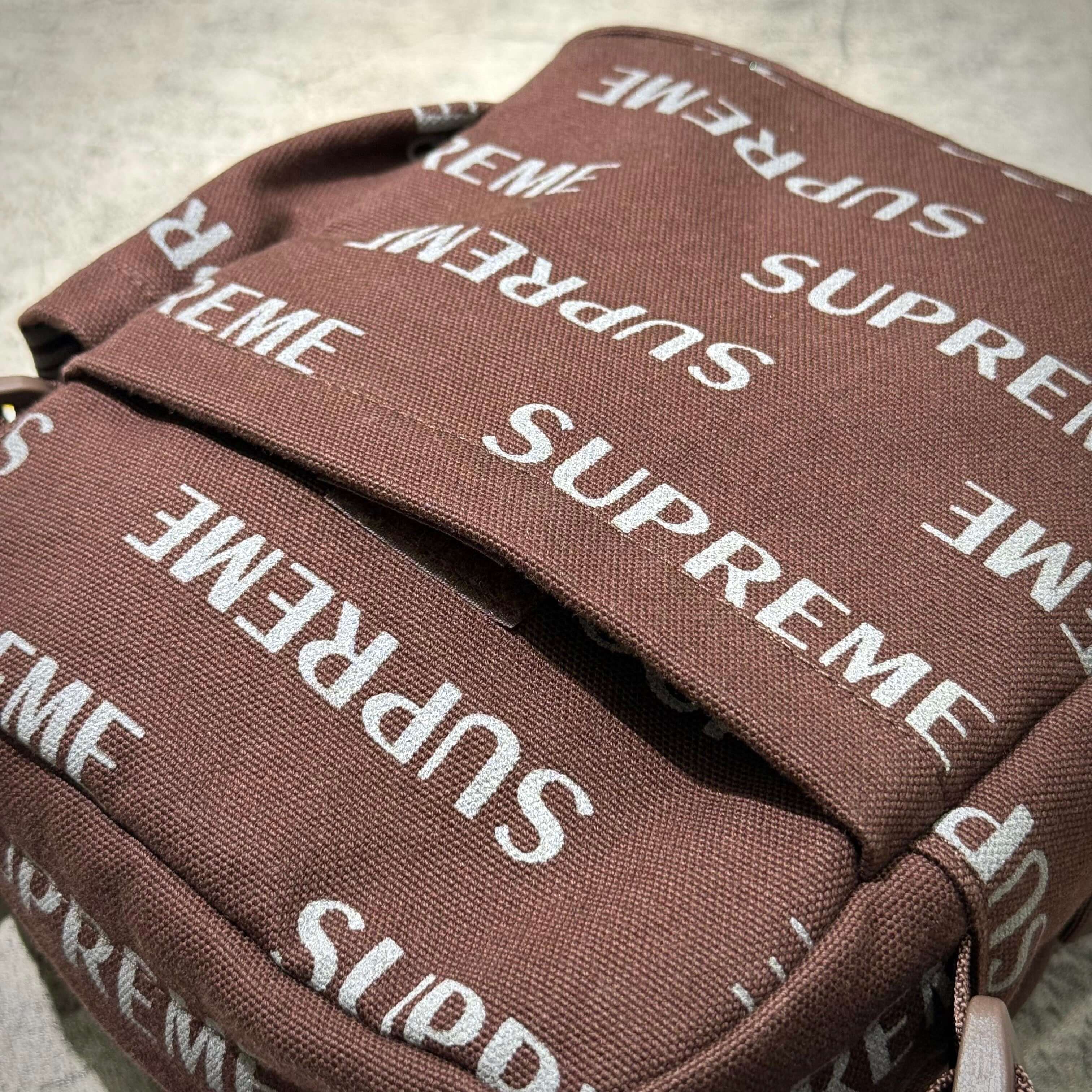 Supreme FW26 Shoulder Bag featuring iconic Supreme logo in a brown pattern.