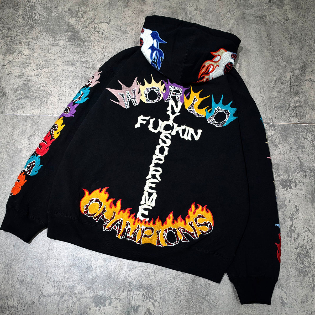 Supreme Fuck You Zip Up Hooded Sweatshirt featuring colorful graphics and bold text on a black background.