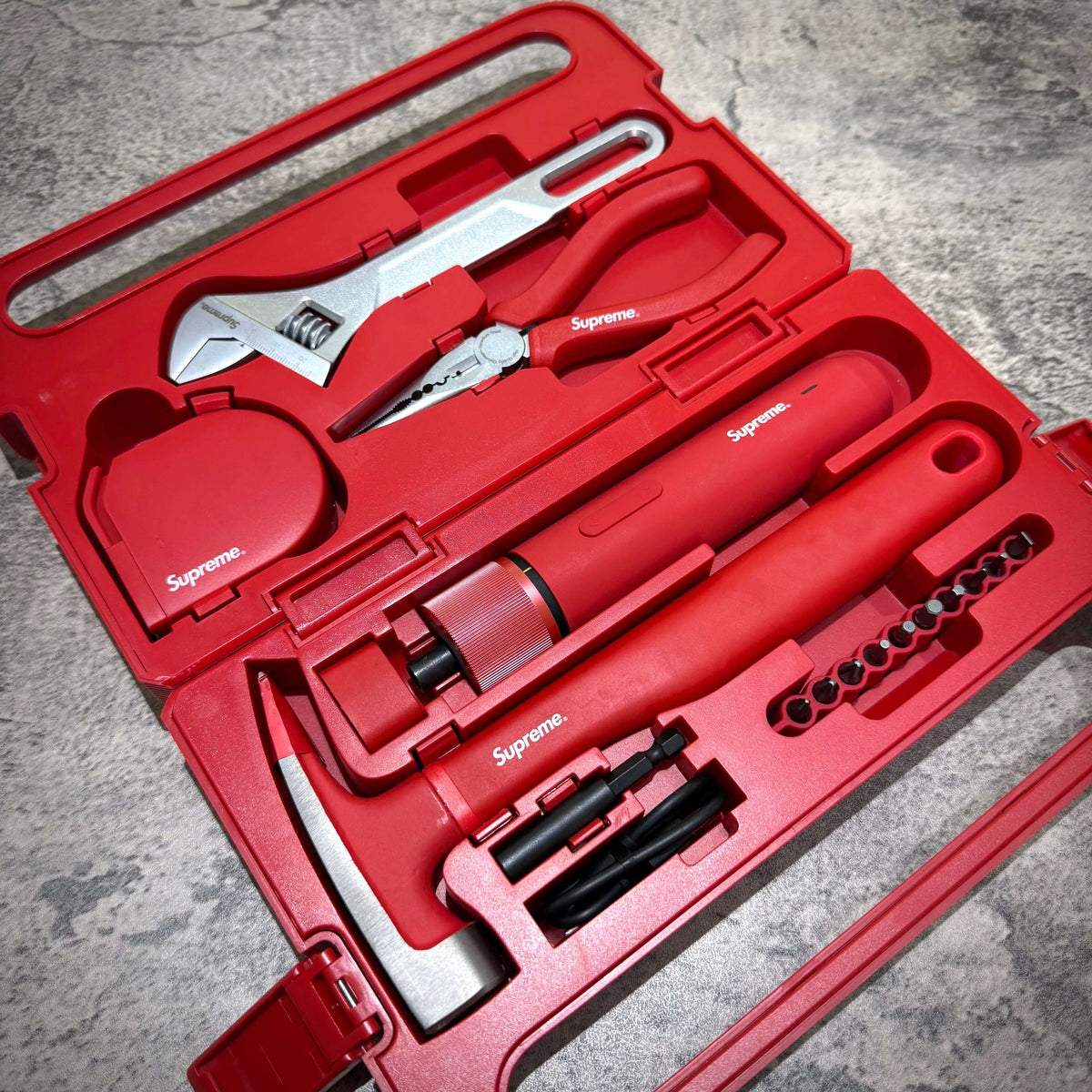 Supreme x Hoto 5-Piece Tool Set featuring various tools in a red case with printed logos.