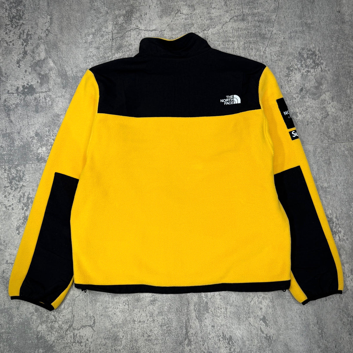 Supreme x The North Face Arc Logo Denali Fleece Jacket - Yellow, back view with logo details.
