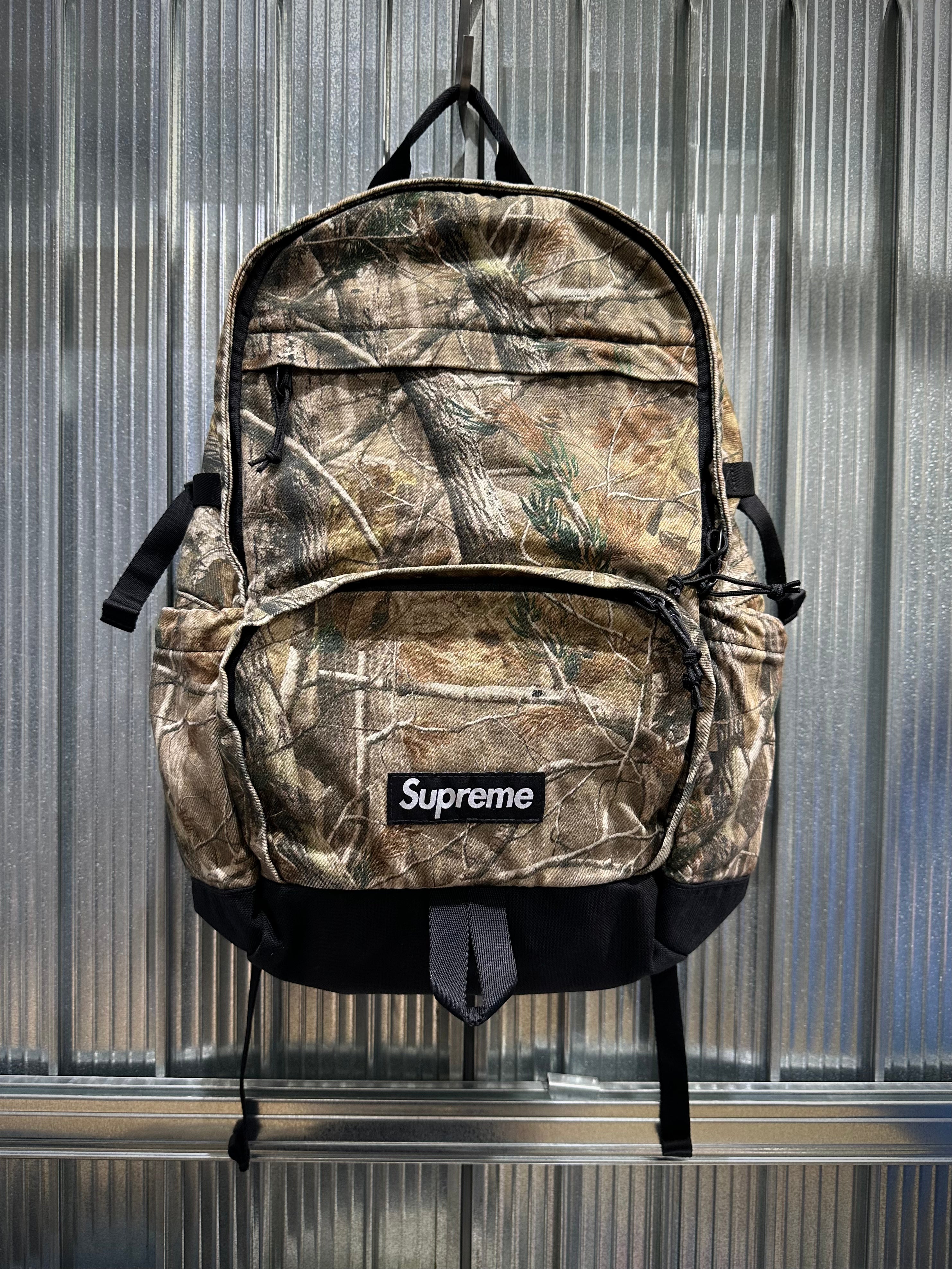 Supreme Denim Backpack FW25 washed indigo black realtree camo white