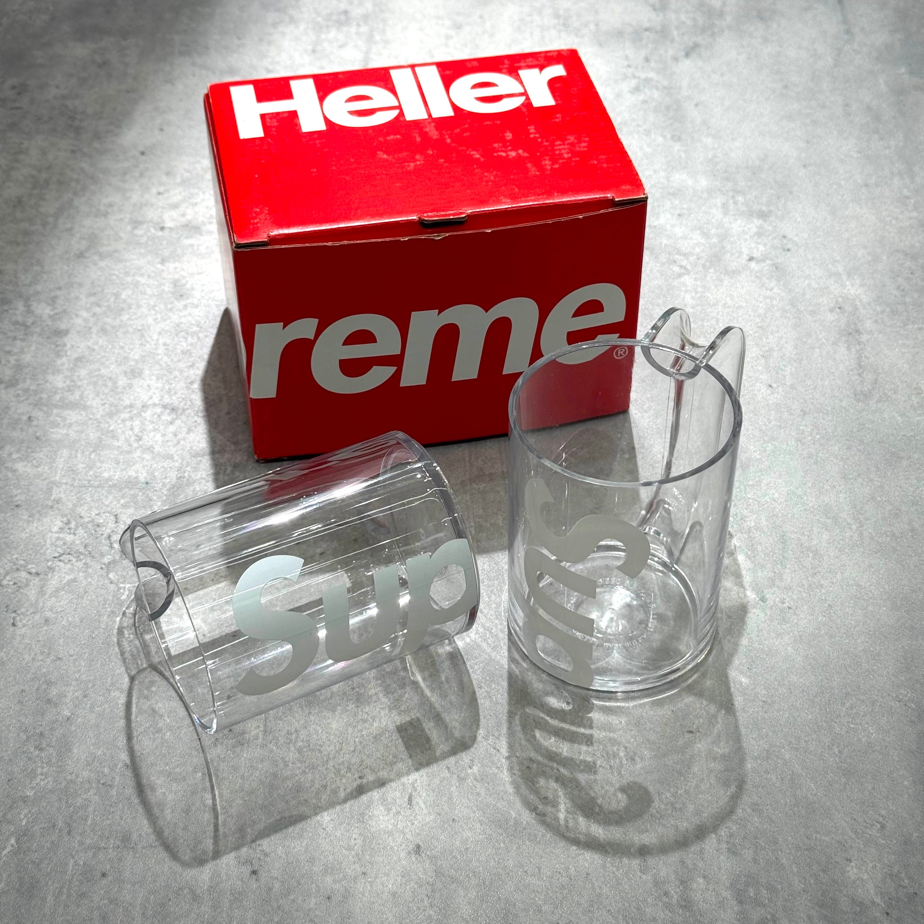 Supreme Heller Mugs (Set of 2) in clear, showcasing the unique design and red packaging.
