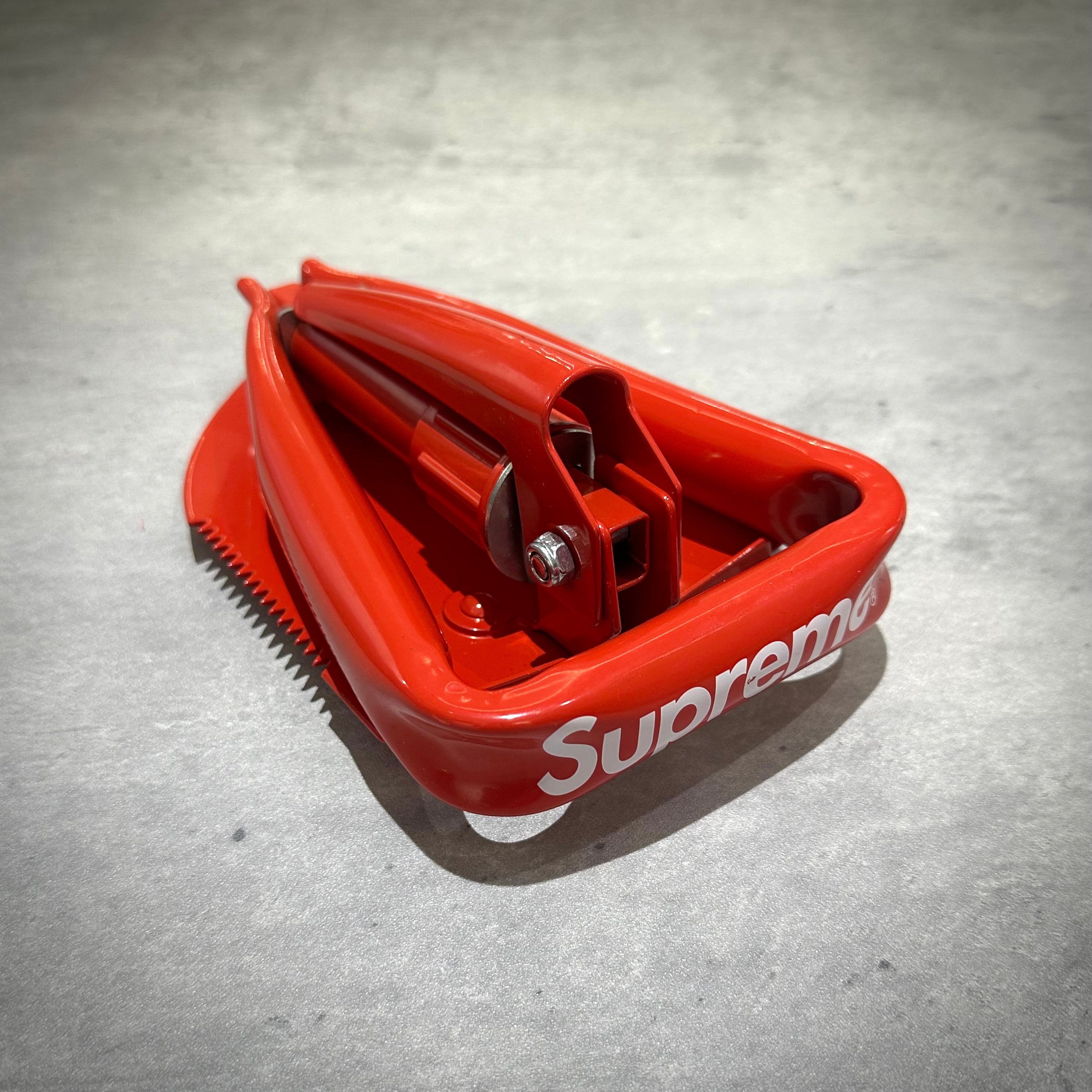 Supreme SOG Collapsible Shovel in red color showcasing its compact design and functionality.