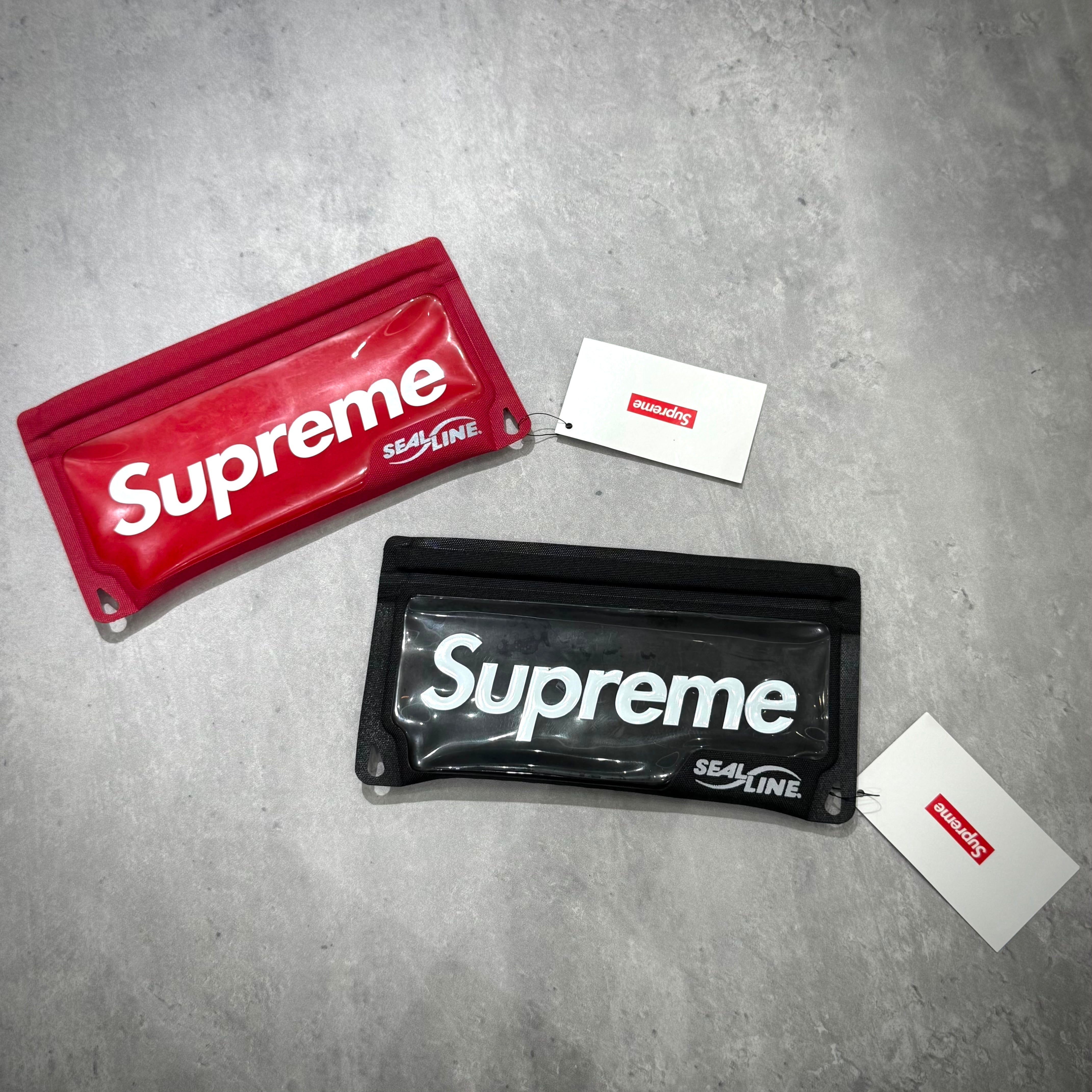 Supreme SealLine Waterproof Case in red and black, showcasing premium waterproof material and authentic branding.