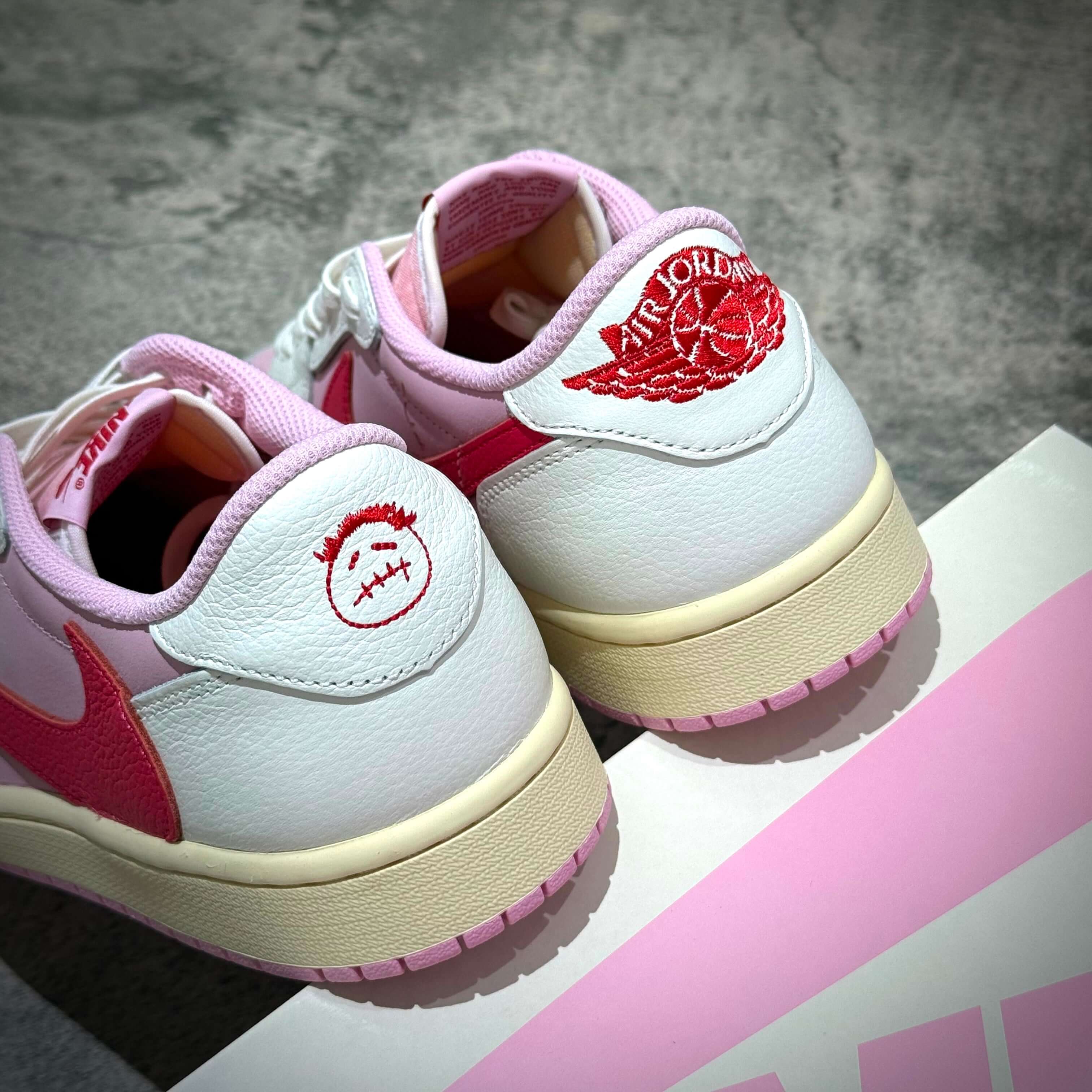 Travis Scott × Nike Air Jordan 1 Retro Low SP - Tropical Pink sneaker detail with signature logo on the heel.
