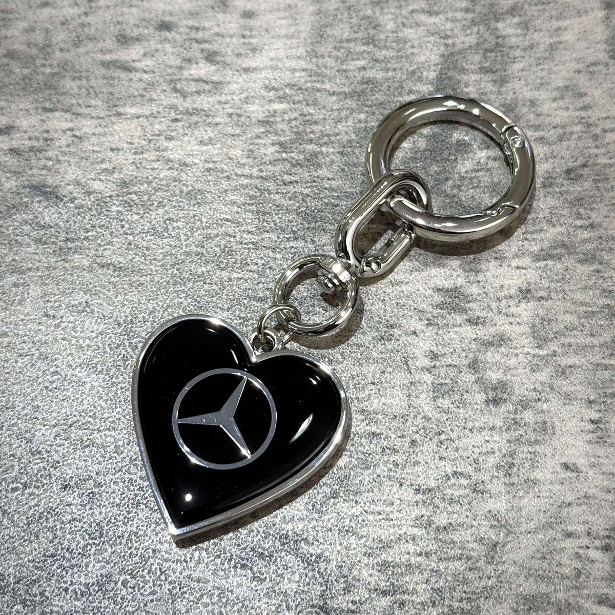 VERDY x Mercedes-Benz STUDIO TOKYO Keyring featuring a black heart charm with Mercedes-Benz logo.