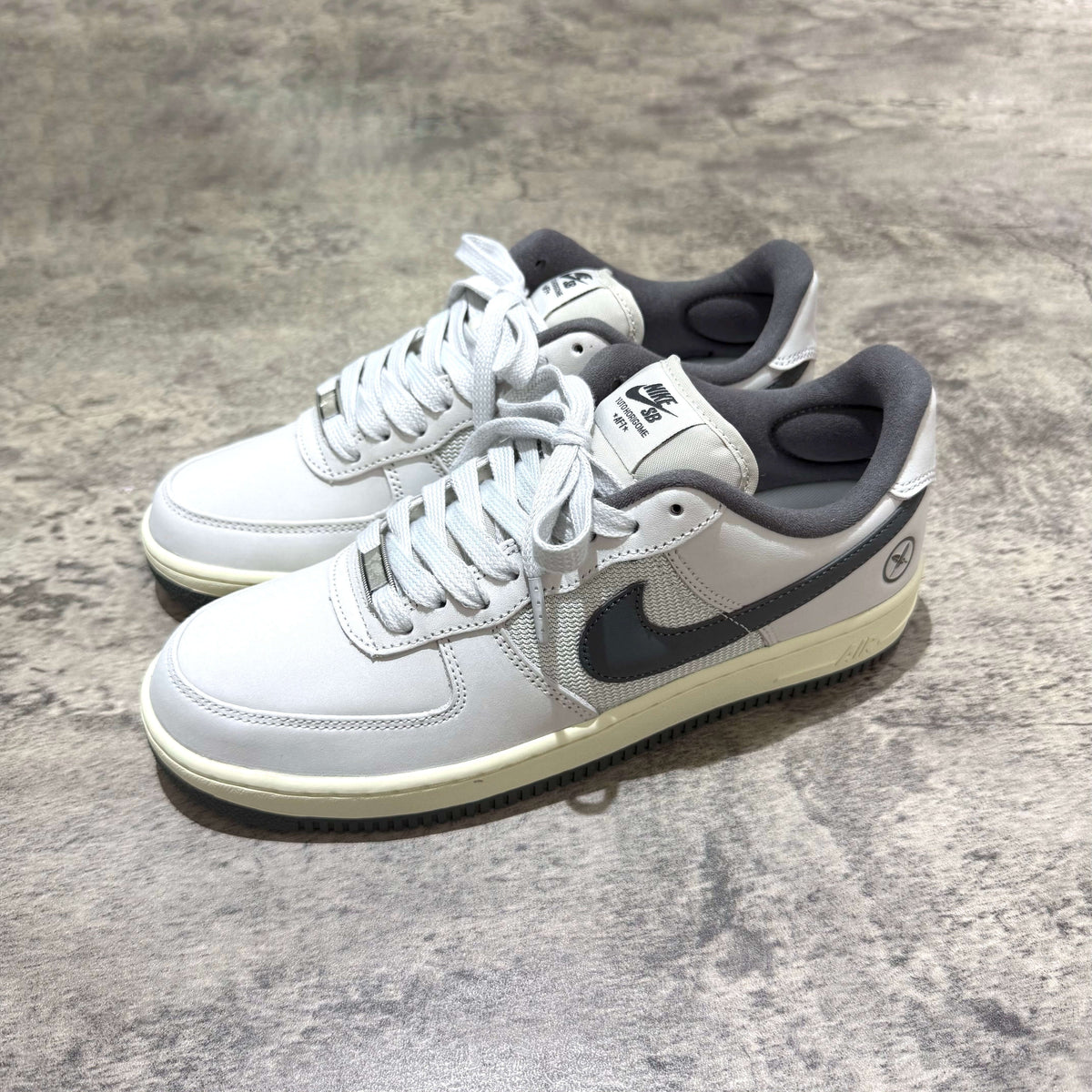 Yuto Horigome x Nike SB Air Force 1 Low IO8439-100 sneakers in gray colorway, seen from the side.