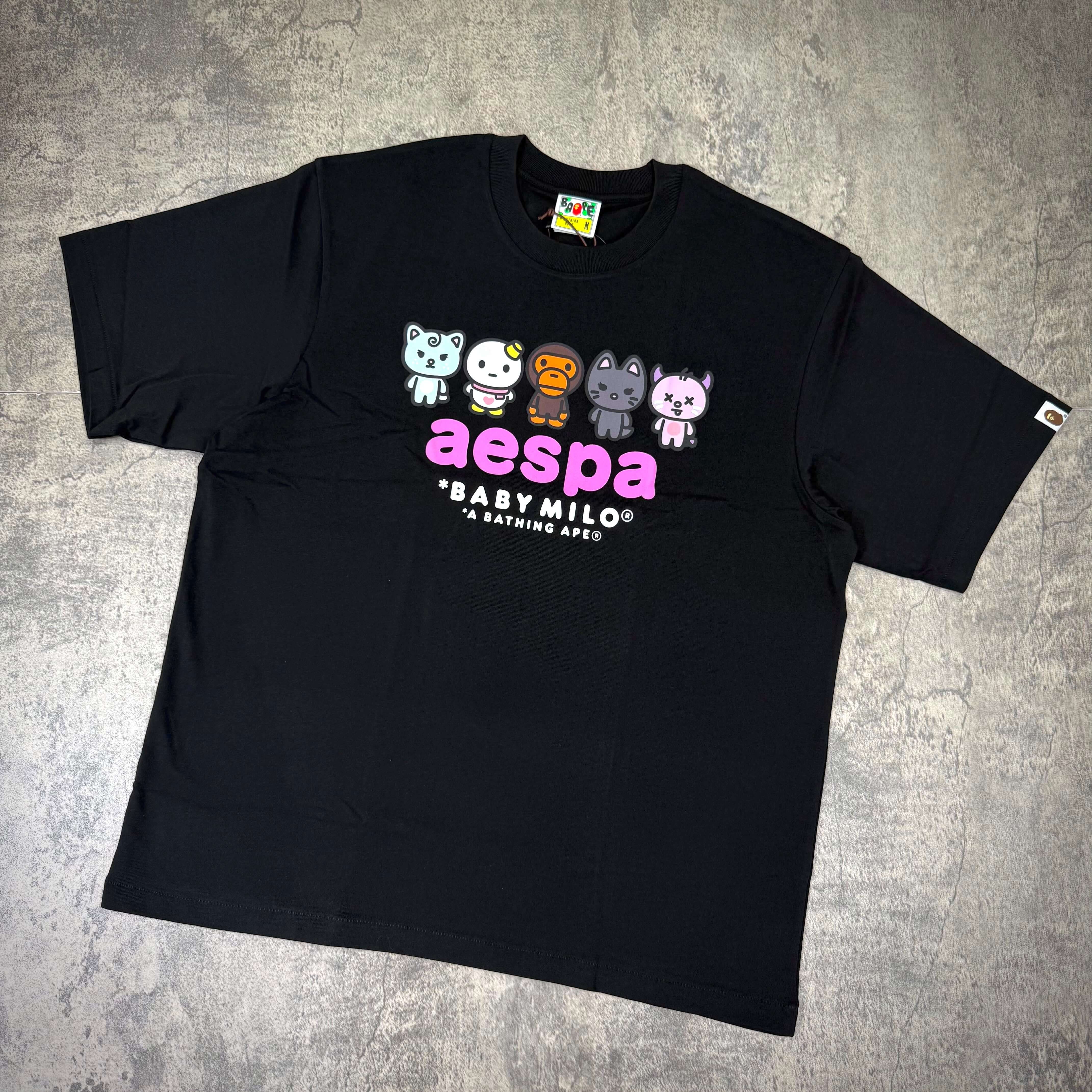 aespa x BAPE Baby Milo Relaxed Fit Tee featuring colorful characters and the brand logo, perfect for casual wear.