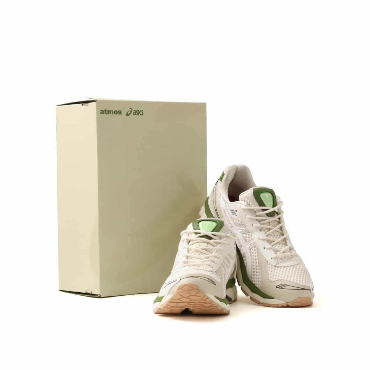atmos x Asics Gel-Kayano 12.1 Archipelago sneakers with green accents and box.