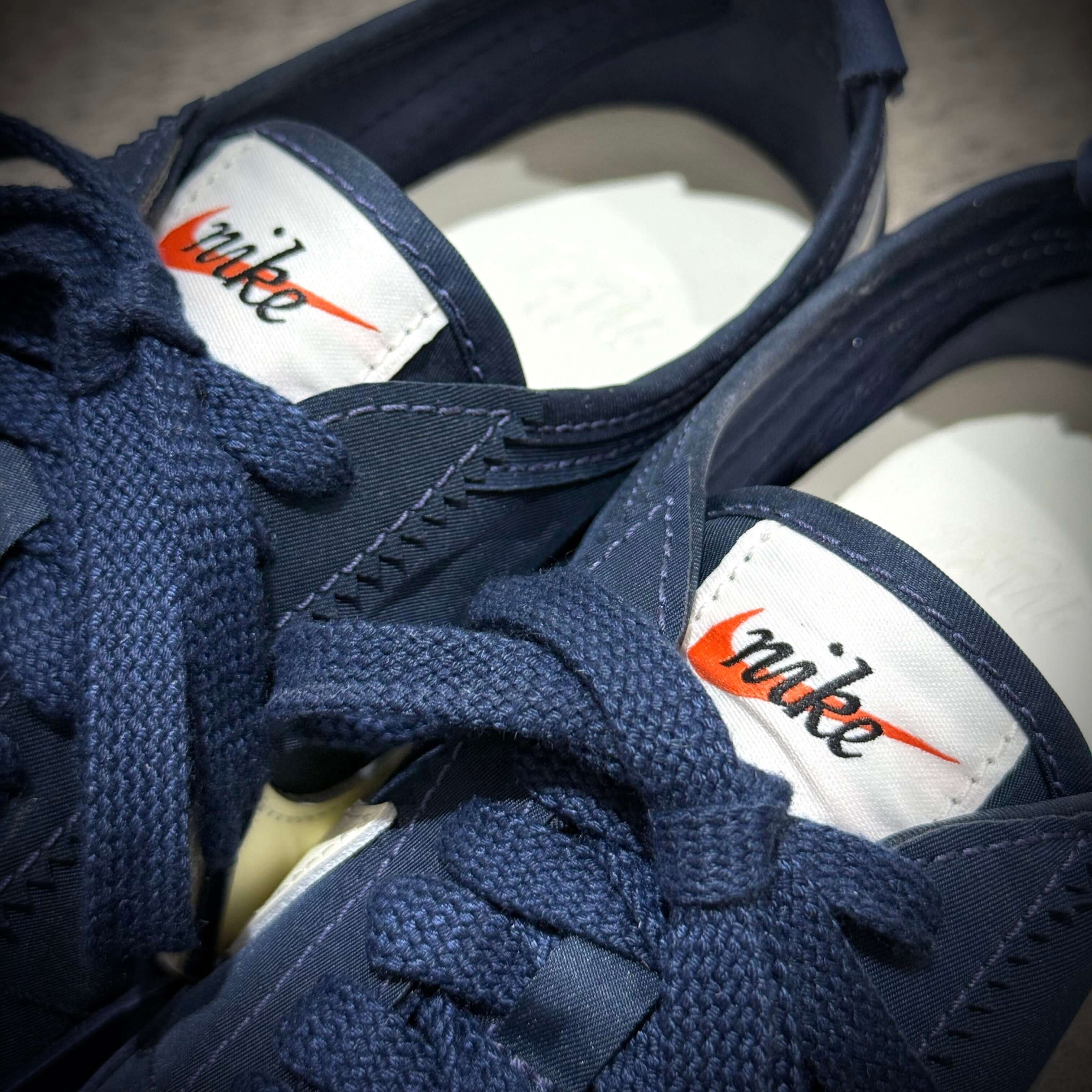 Close-up of Nike Moon Shoe OG - Midnight Navy showing laces and branded tag.