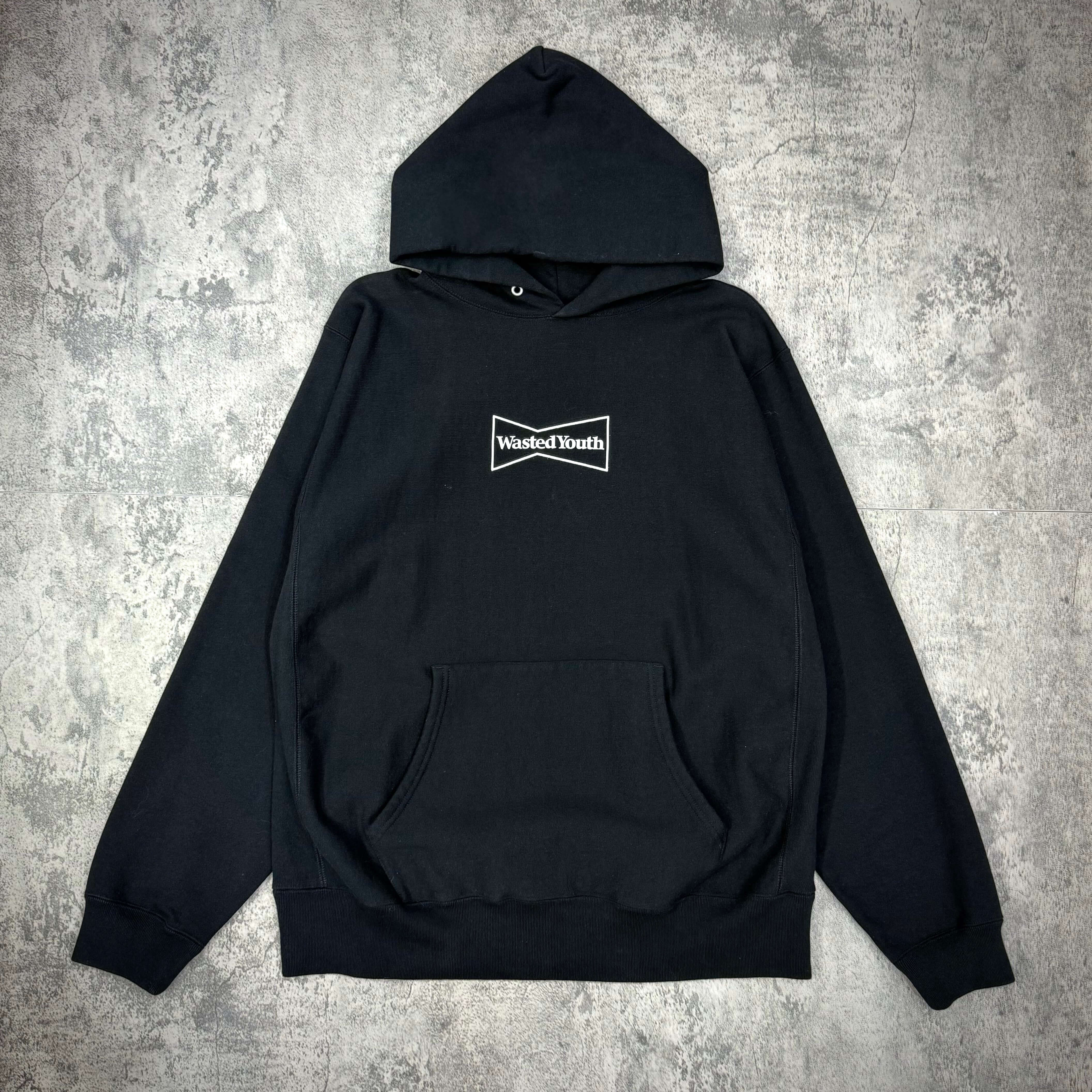 Wasted Youth Hoodie - Black, front view, featuring logo and kangaroo pocket, stylish streetwear garment.