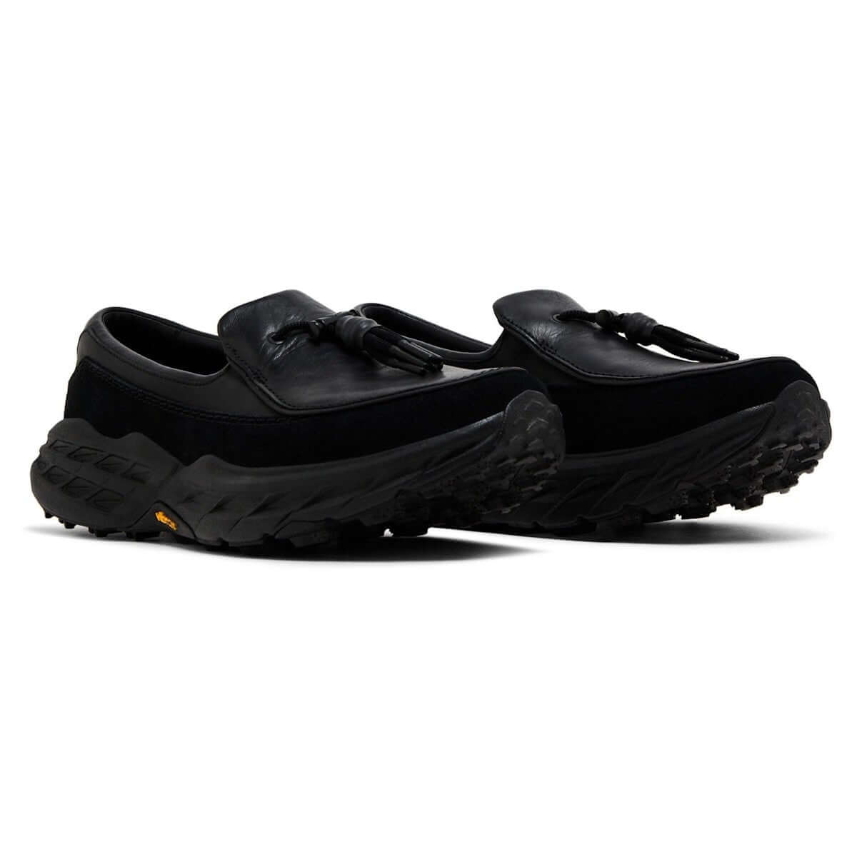 Hoka Speed Loafers - Black 1162170-BBLC displayed from the side, featuring a sleek black design and trail-engineered outsole.