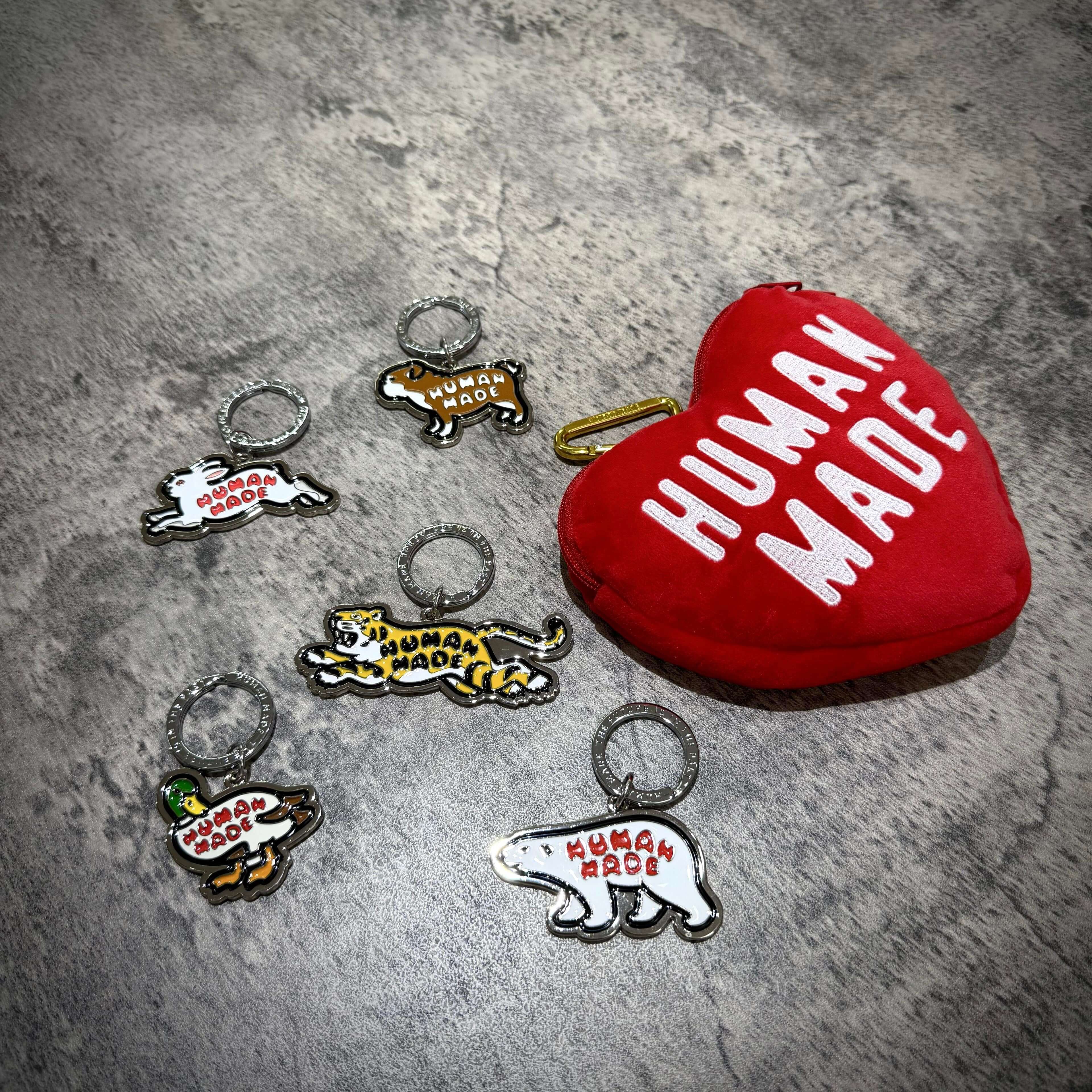 Human Made Animal Keyring collection featuring various animal designs and a red heart-shaped pouch.