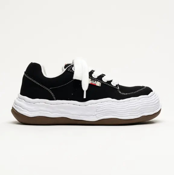 MMY Oliver Canvas Low - Black side view shoe with unique textured sole and laces.