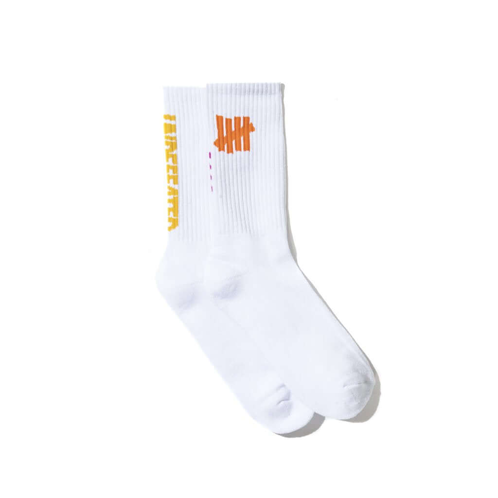 Anti Social Social Club x Undefeated Socks displayed on a white background, showcasing unique branding.
