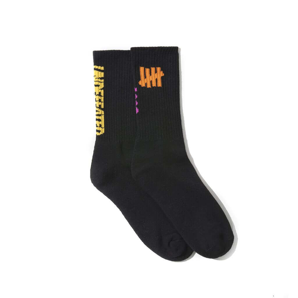 Anti Social Social Club x Undefeated Socks featuring black fabric with unique branding and colorful accents.