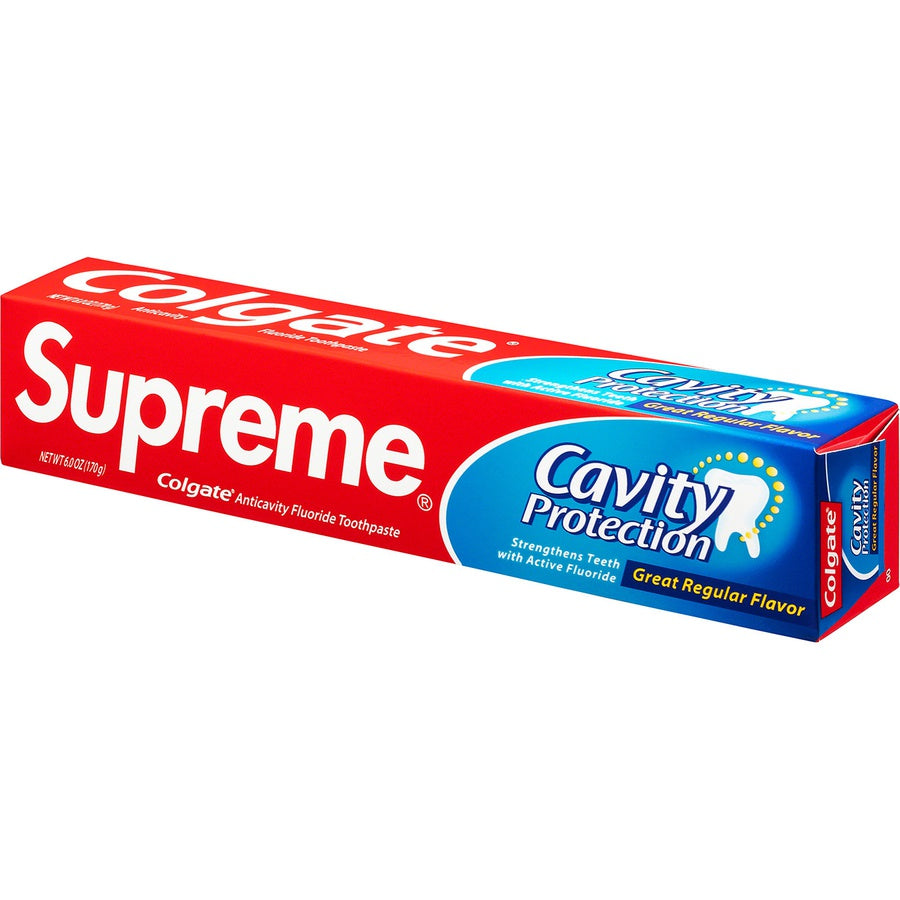 Supreme Colgate Toothpaste - White packaging showcasing cavity protection and active fluoride benefits.