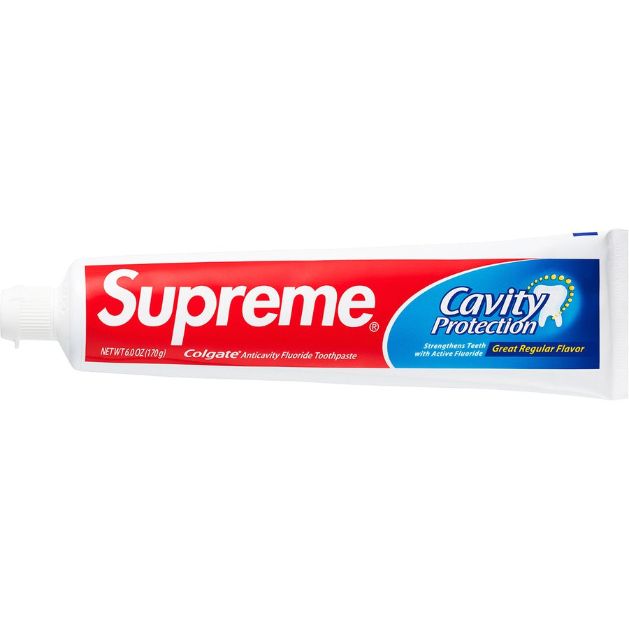 Supreme Colgate Toothpaste - White tube featuring cavity protection and refreshing flavor.