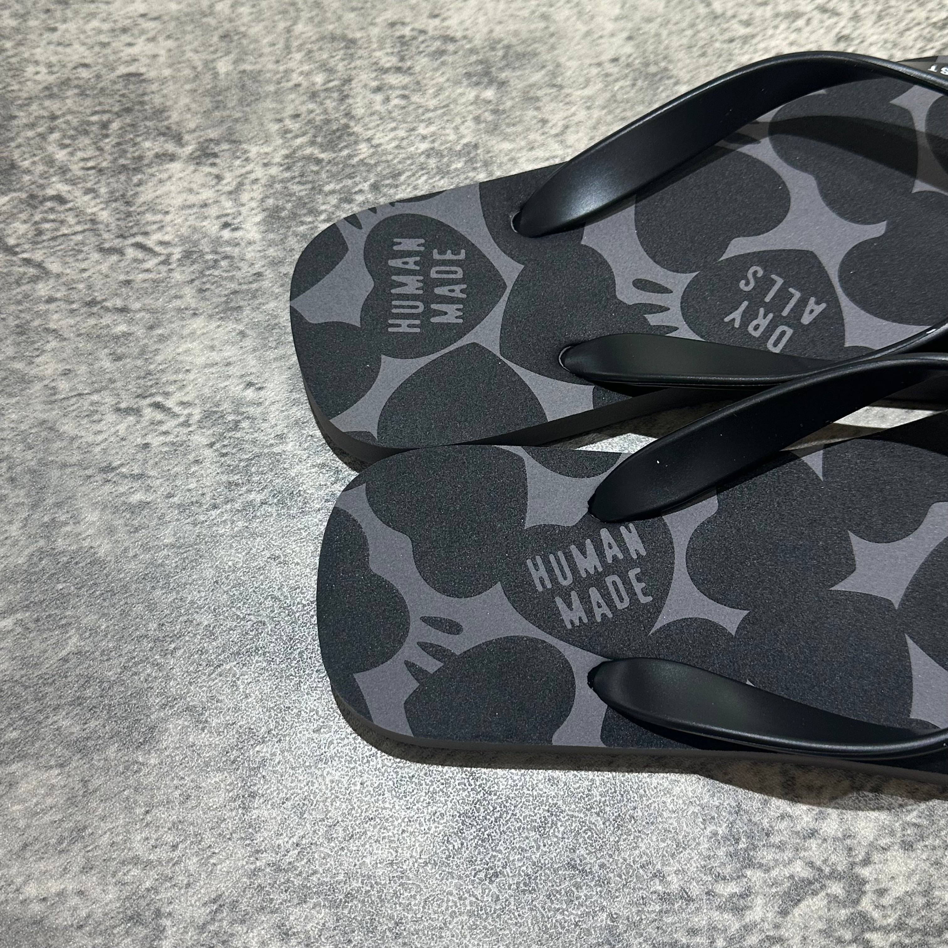 Human Made Sandal with black straps and patterned footbed, showcasing the Human Made logo.