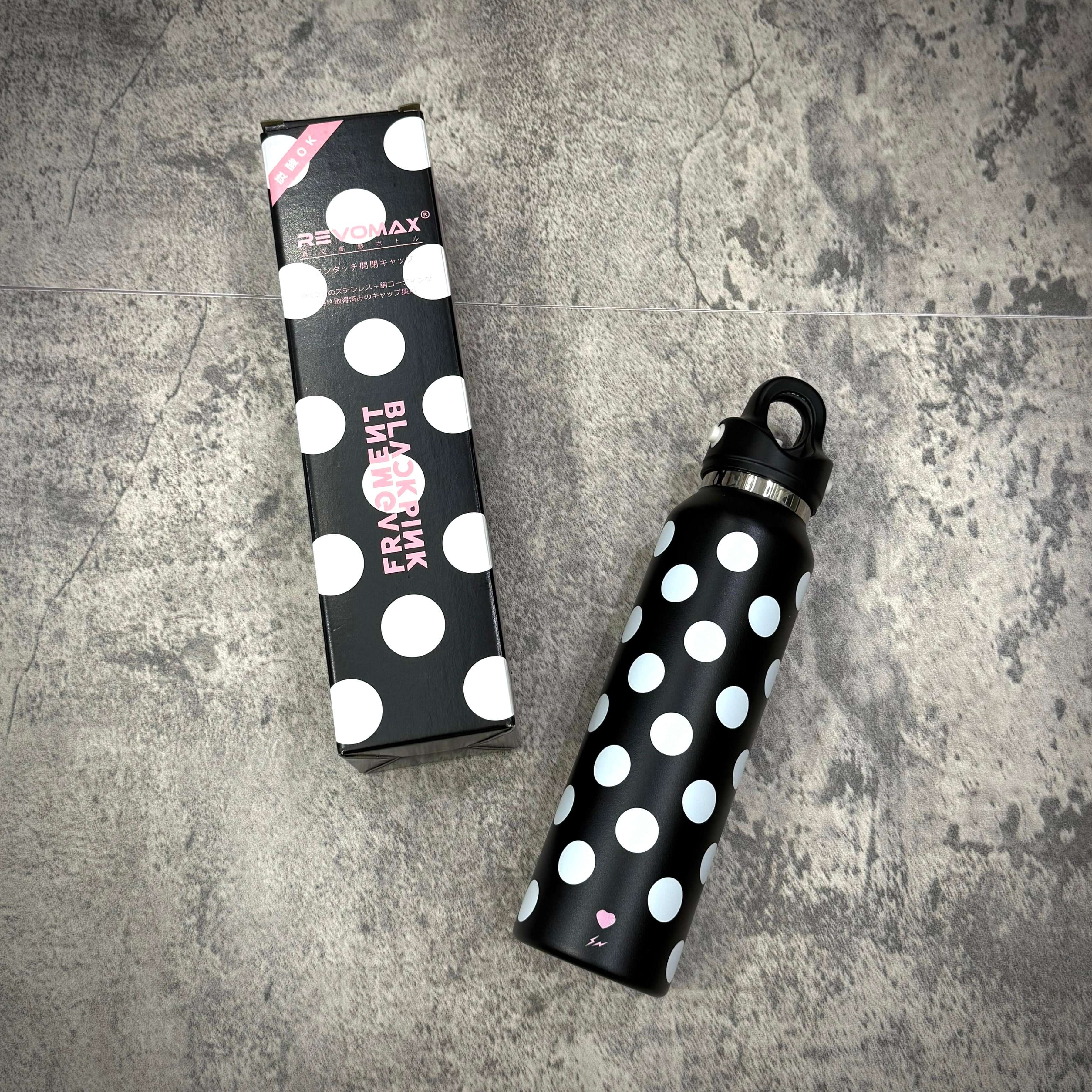 Fragment x Blackpink REVOMAX 16oz carbonated tumbler with polka dot design and packaging on a textured surface.