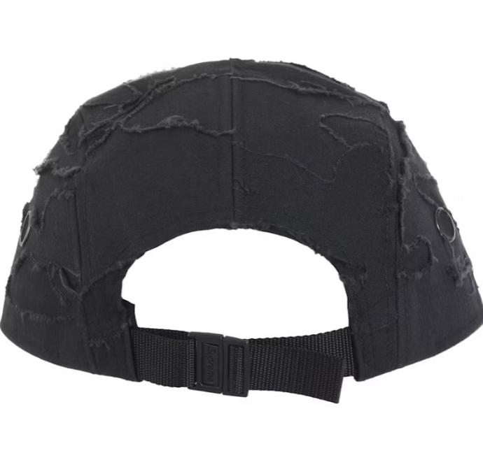 Back view of the Supreme Layered Camo Camp Cap showcasing distressed fabric and adjustable strap.