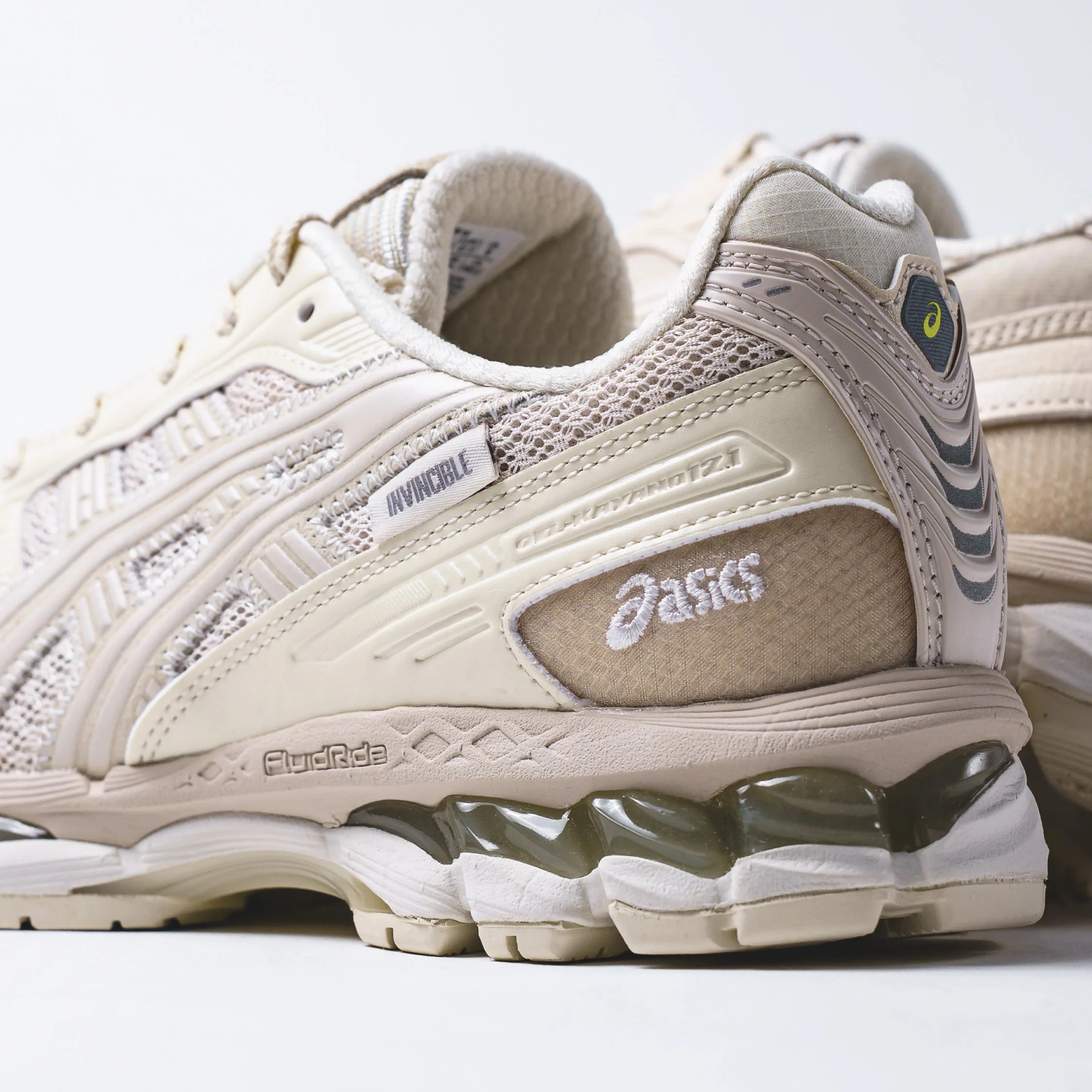 Madness x Invincible x Asics Gel-Kayano 12.1 Vanilla sneakers with beige and cream colors.