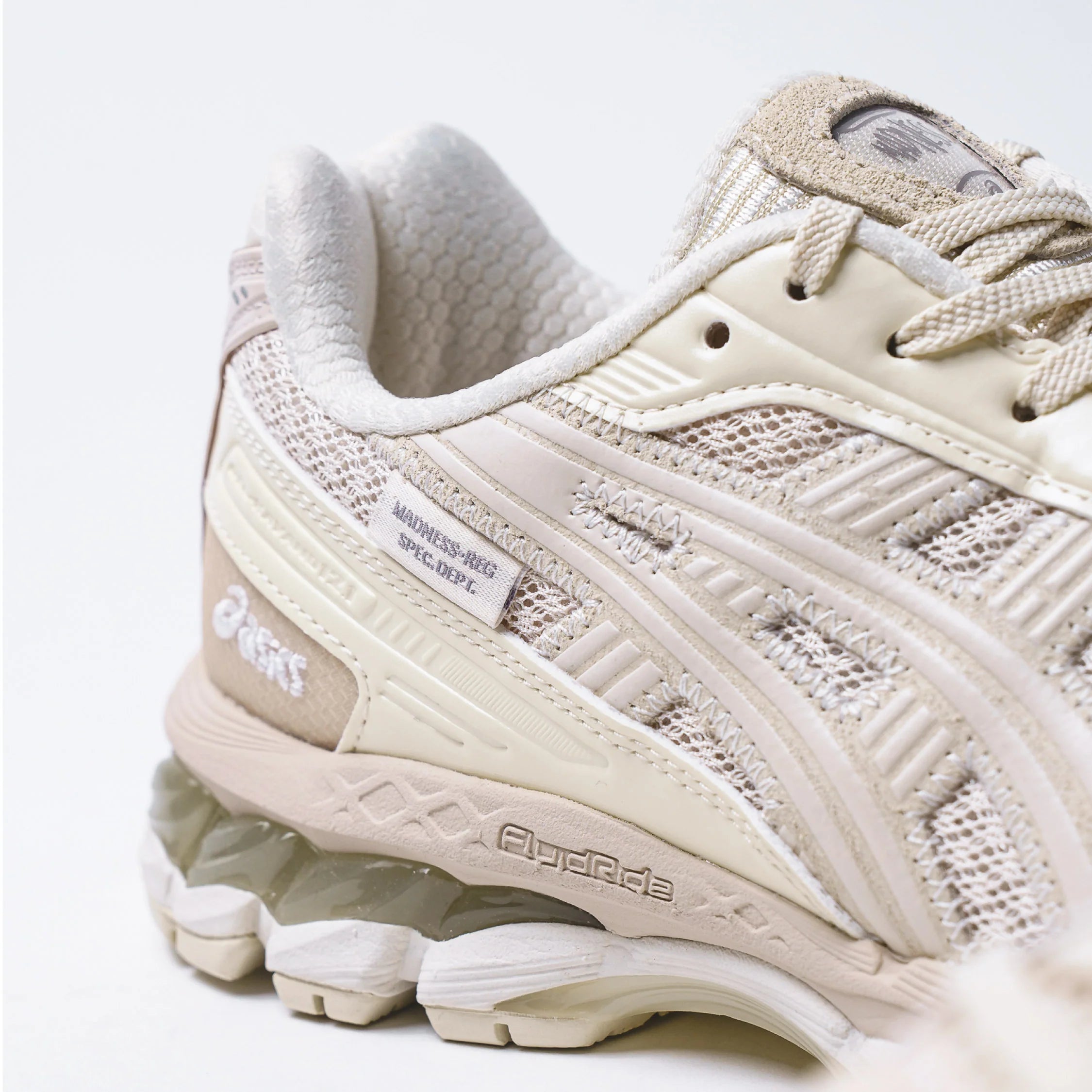 Detail of Madness x Invincible x Asics Gel-Kayano 12.1 Vanilla sneaker features and textile design.