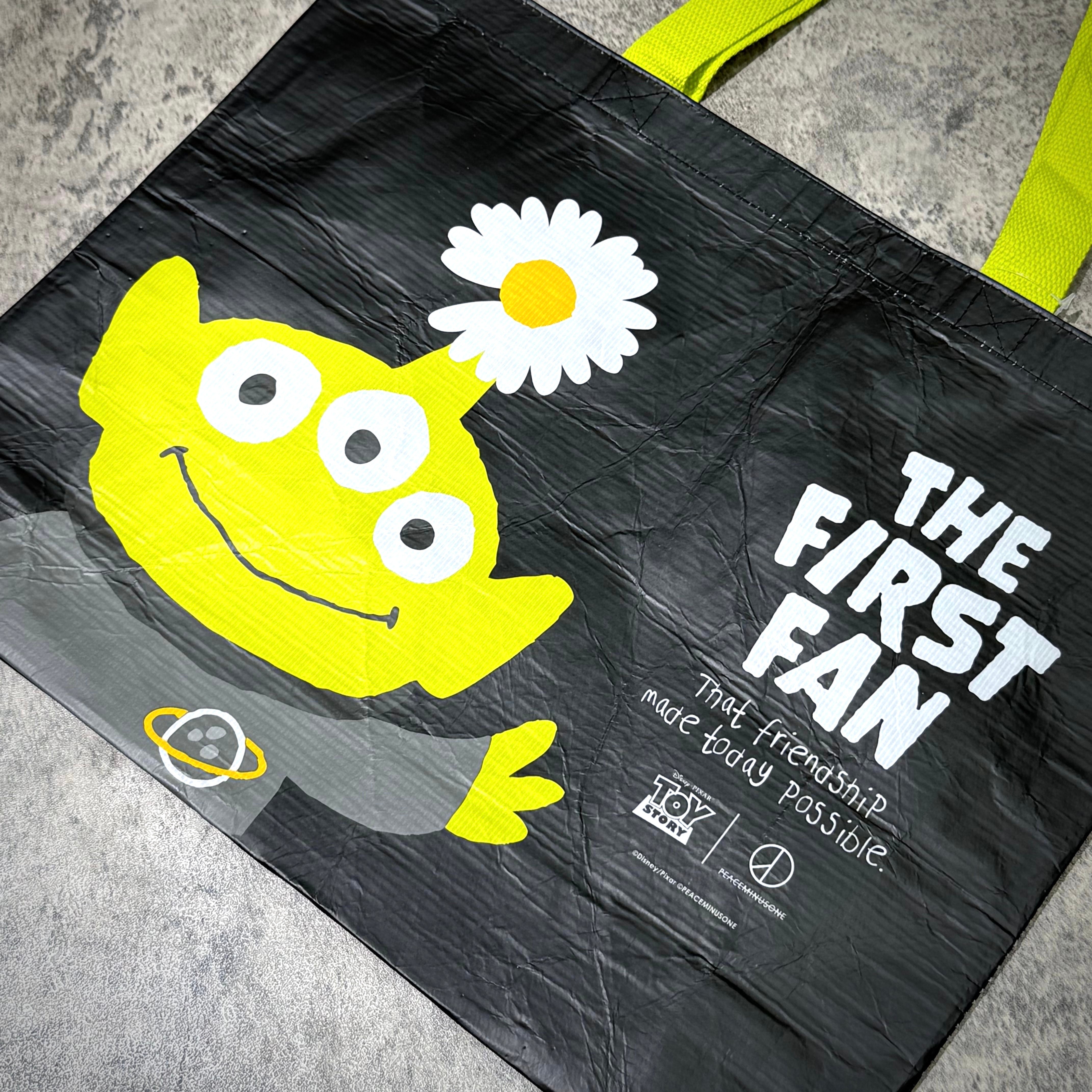 PEACEMINUSONE x Toy Story reusable bag featuring the character from Toy Story with the text 'THE FIRST FAN'