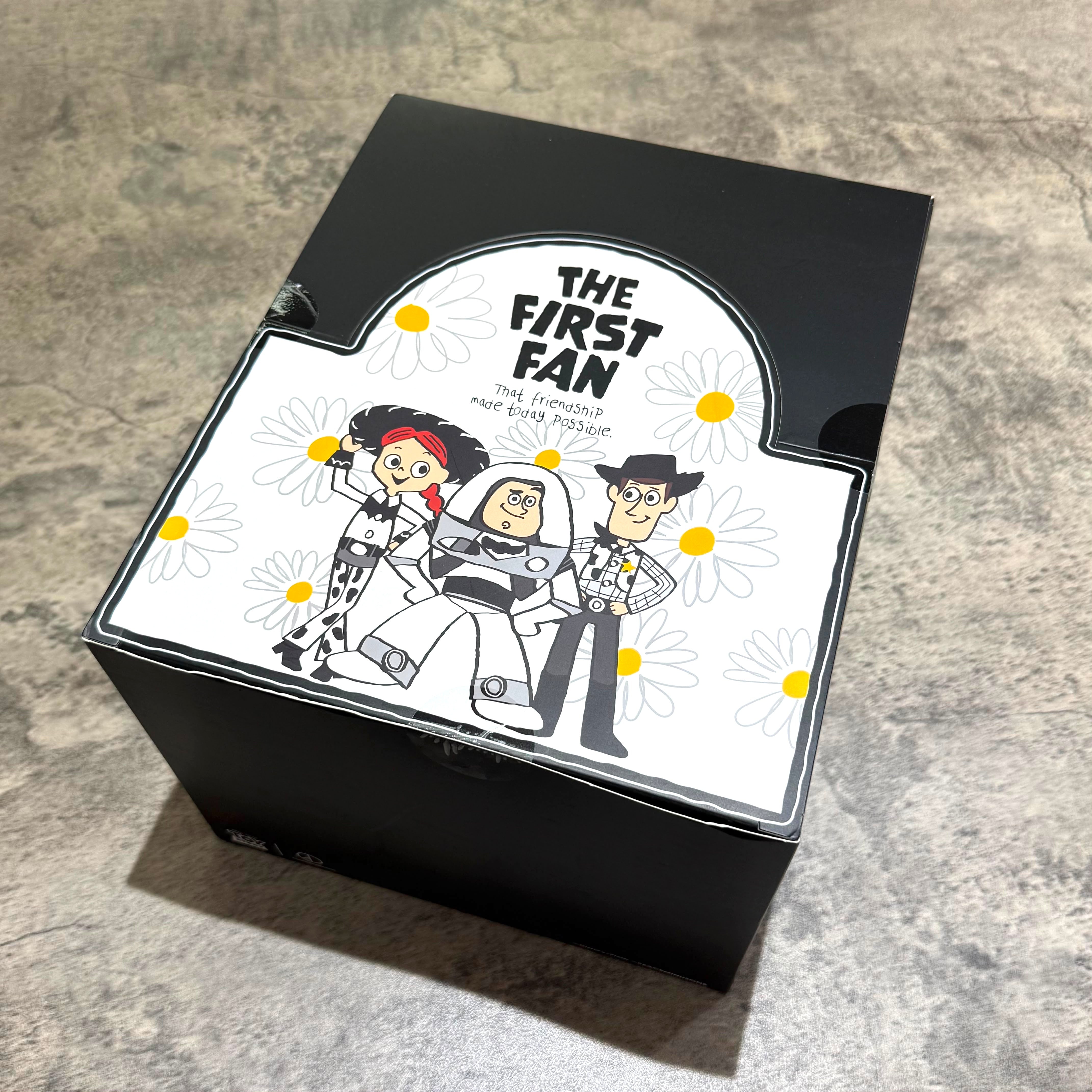 PEACEMINUSONE x Toy Story The First Fan - Blind Box packaging featuring characters with daisies backdrop