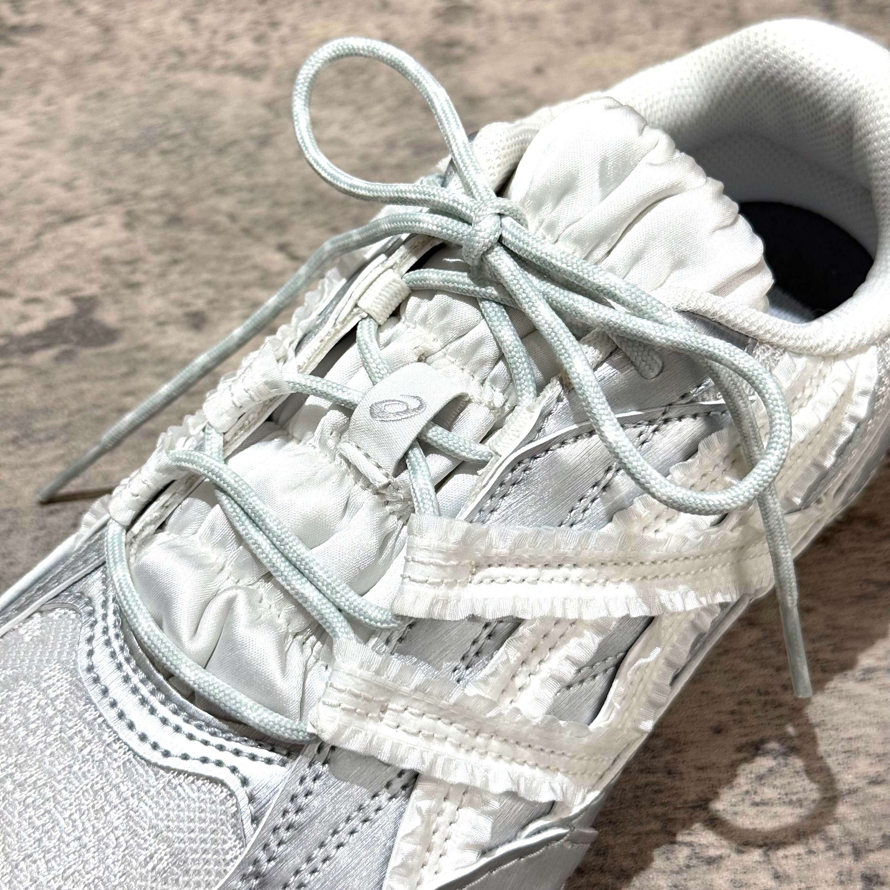 Asics x Empty Behavior Hypersync - Pure Silver White sneaker with unique lacing design and soft grey tones.