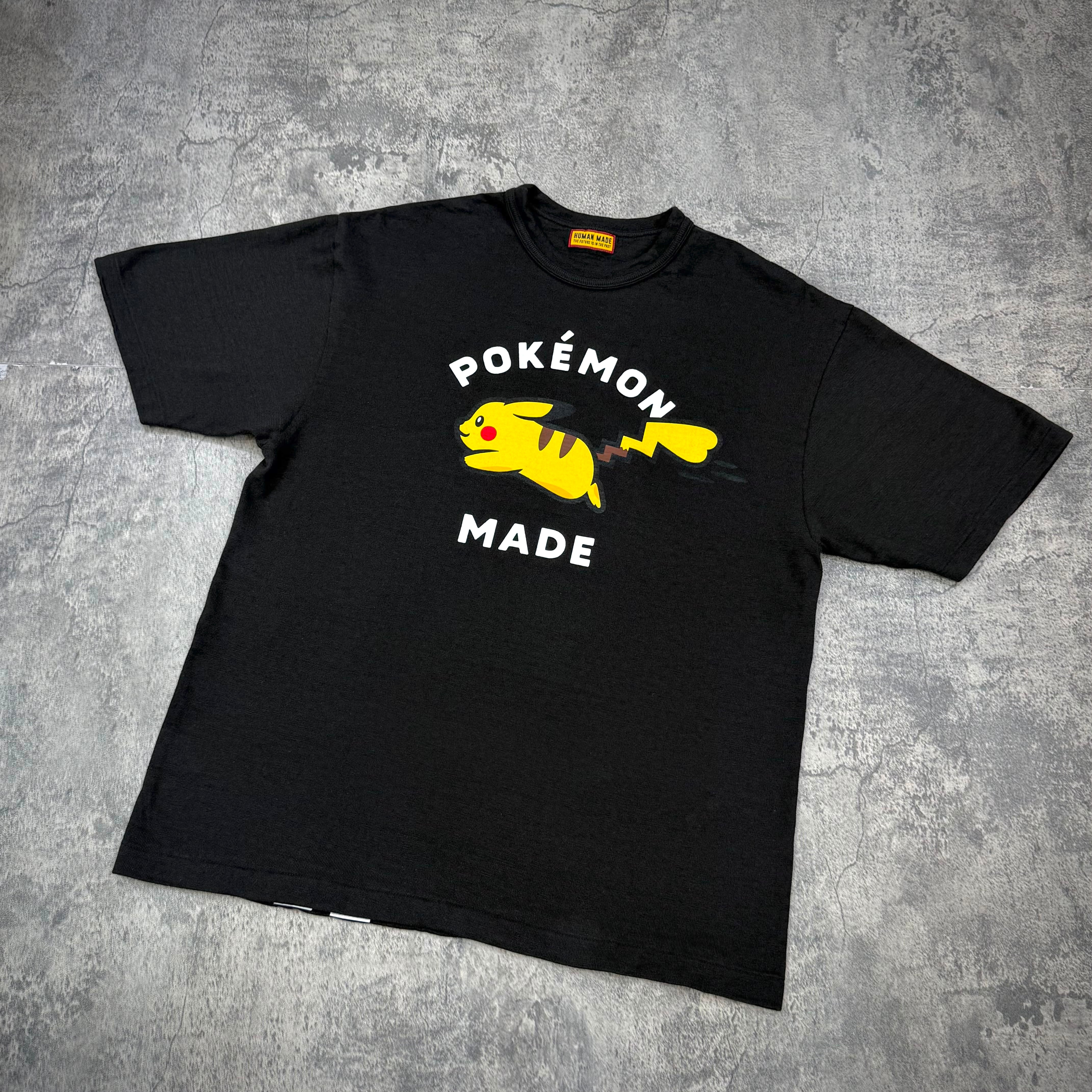 Human Made x Pokemon Graphic Tee featuring Pikachu with bold text on a black background.