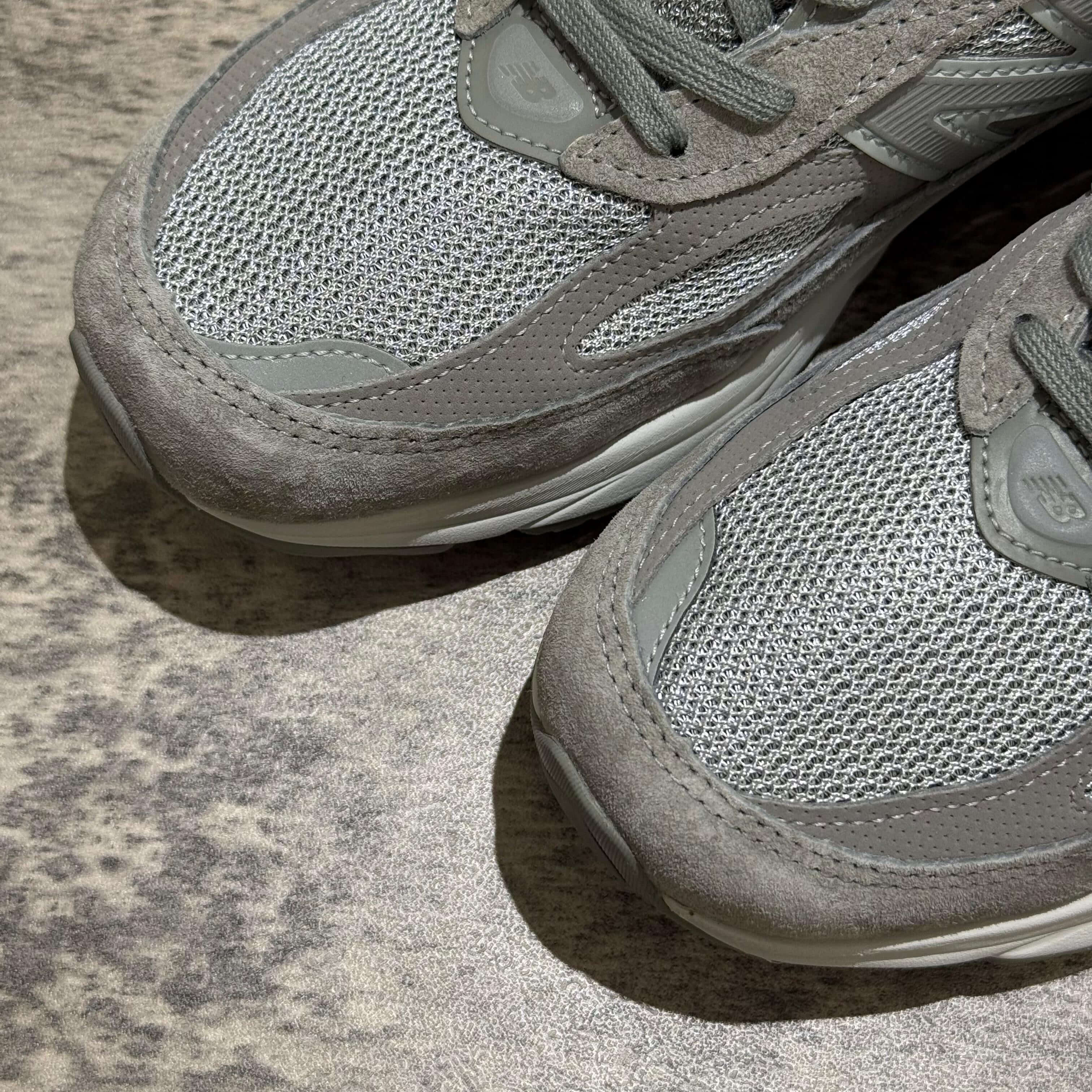 New Balance x Wtaps 990v6 close-up of grey mesh and suede sneaker details